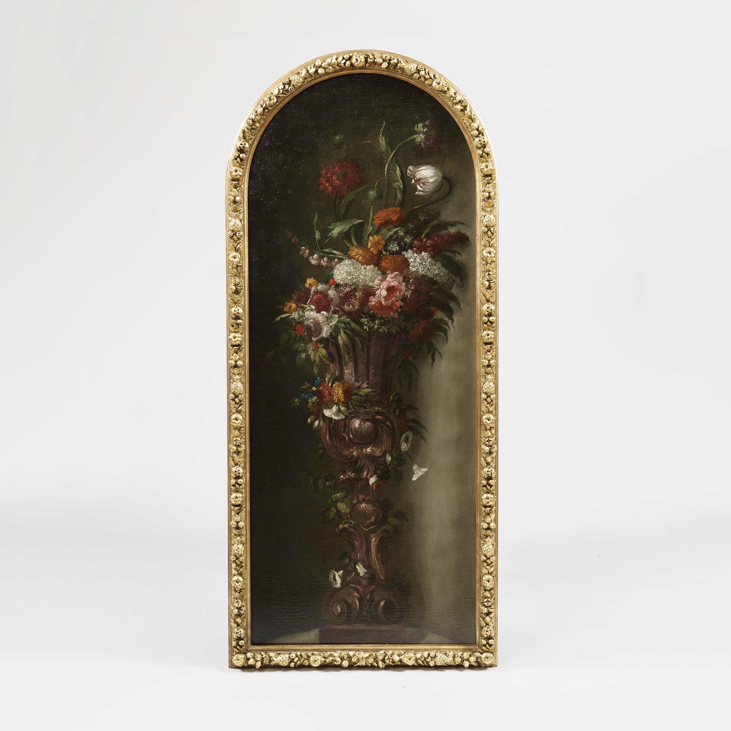 A pair of still-life paintings

The large scenes executed in oil depicting large flower bouquets of tulips, carnations, peonies and morning glories in illusionistic alcoves. Housed in finely carved giltwood frames with arched tops.
Oil on