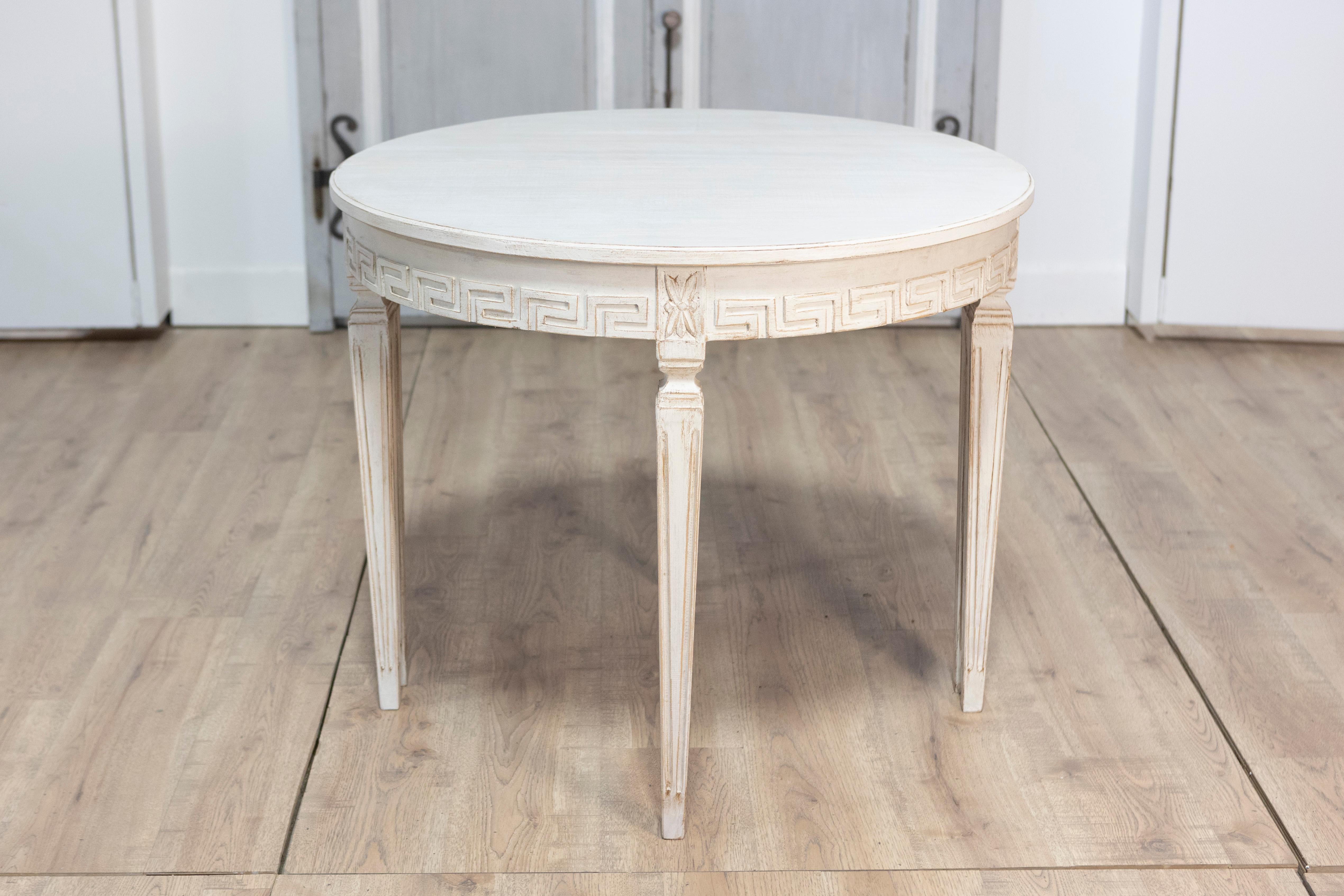 This pair of 19th-century Swedish demi-lune consoles is a refined example of classic Swedish design. Crafted from pine and finished in a soft, distressed white tone, these consoles feature the characteristic half-moon shape that allows them to sit