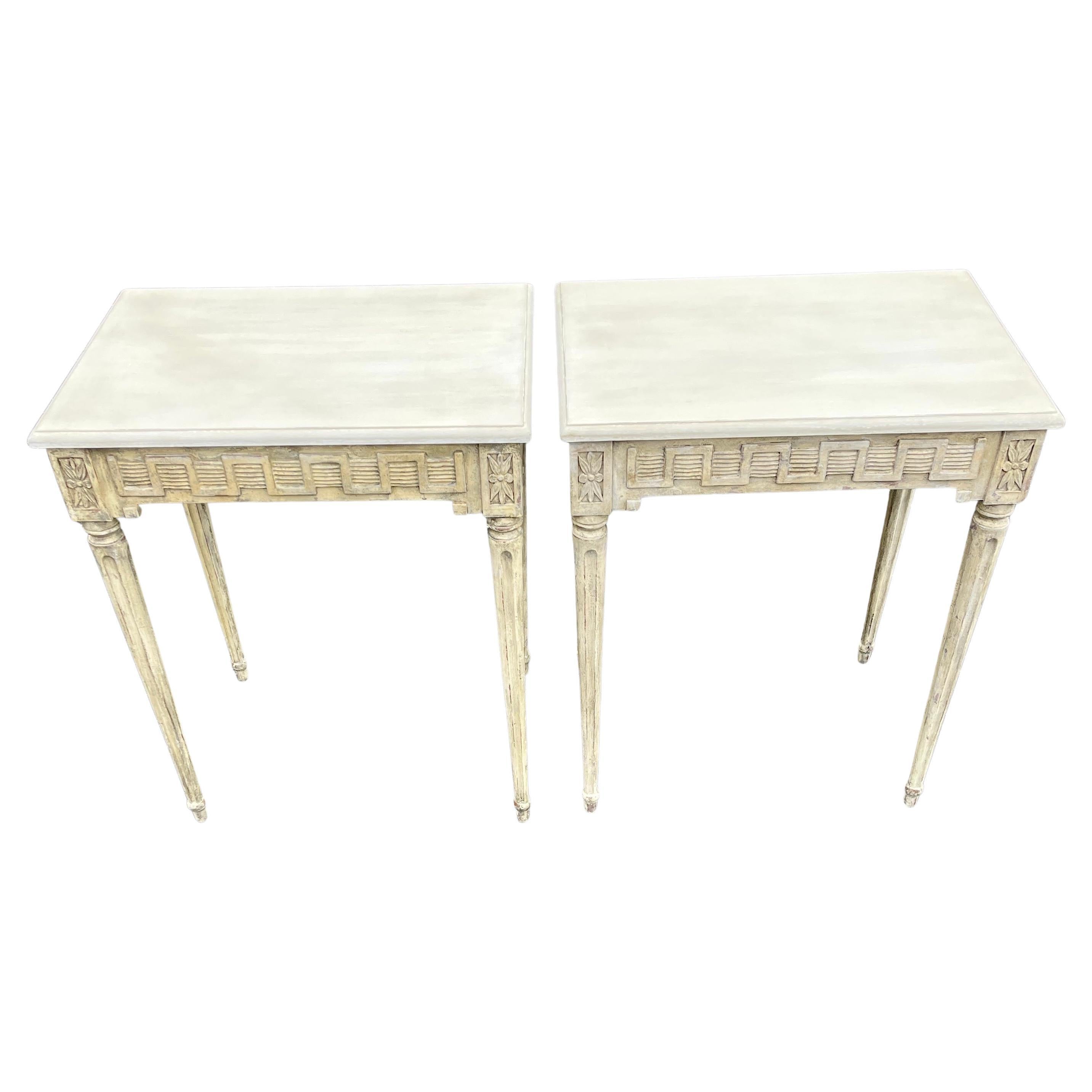 Gustavian Pair of Late 19th Century Painted Console Tables, Sweden 

These Swedish Gustavian painted pair of consoles feature hand carved bases and original patina. The tops have been beautifully refinished in warm tones of gray and cream. With