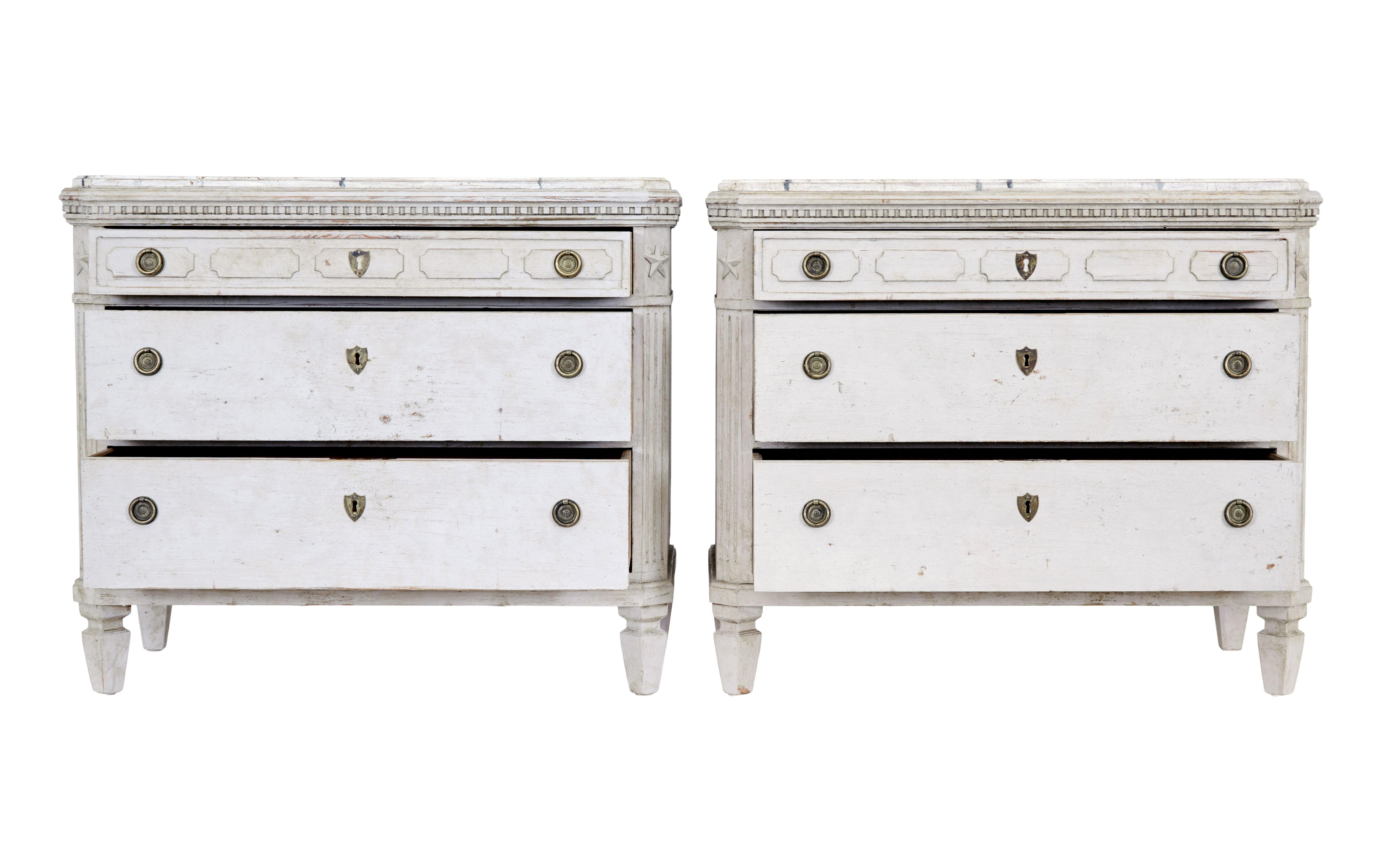 Pair of 19th century swedish painted faux marble top chest of drawers circa 1870.

Hand painted top surface to simulate marble, stepped edge with dentil frieze detailing.  Canted corners with applied star and fluted detailing.  Short top drawer with