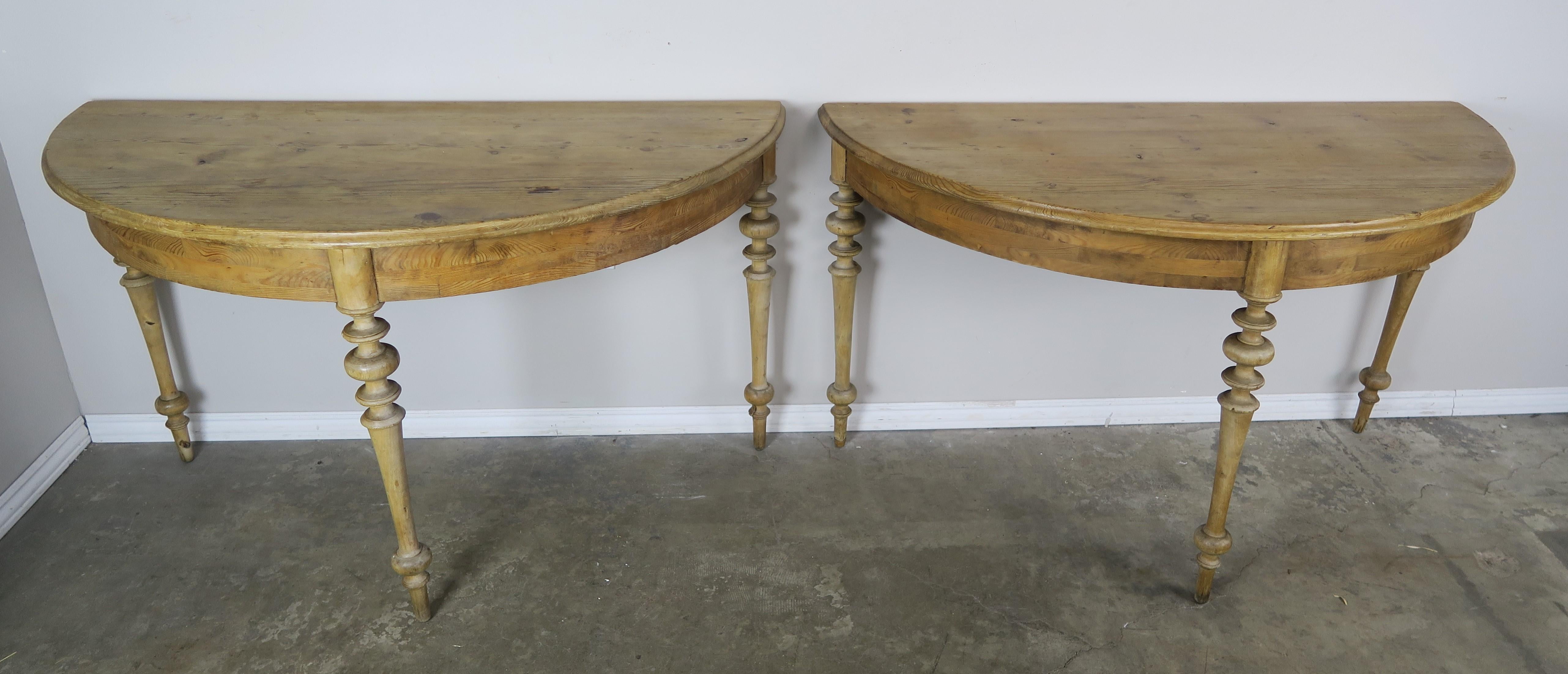 Pair of 19th century Swedish pine wood consoles standing on three beautiful turned straight legs. The consoles have original hardware that attaches tables together to form a single round table.