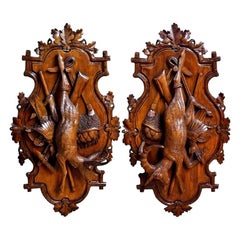 Pair of 19th Century Swiss Black Forest Carved Walnut Hunt Trophies Sculptures