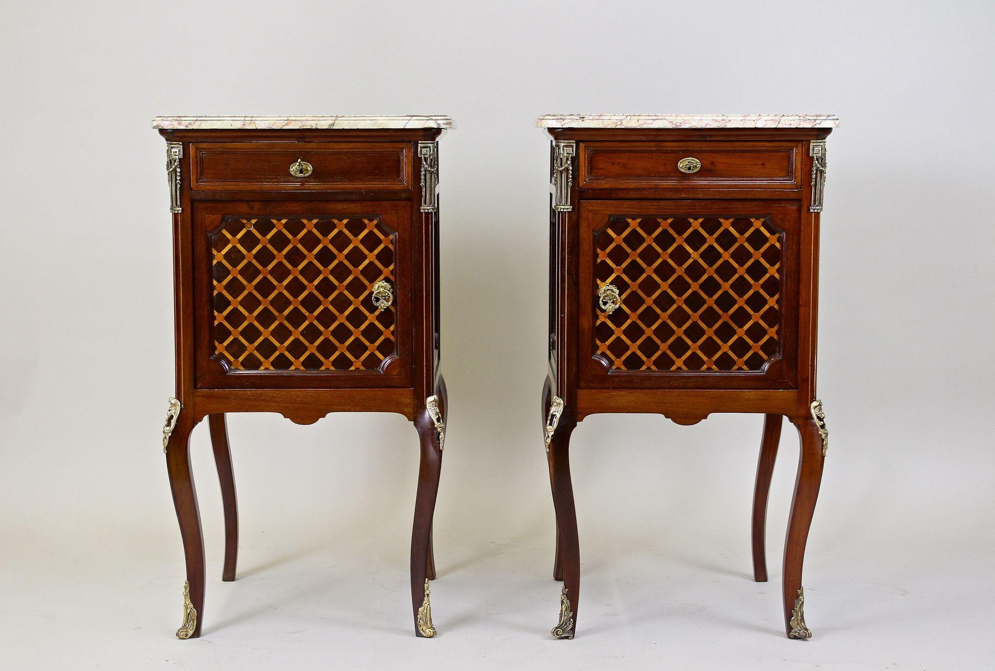 Absolutely beautiful pair of French marquetry pillar commodes/ side tables from the period in France around 1870. An amazing crafted pair of small 19th century transitional mahogany commodes, perfectly restored, impressing with its one of a kind