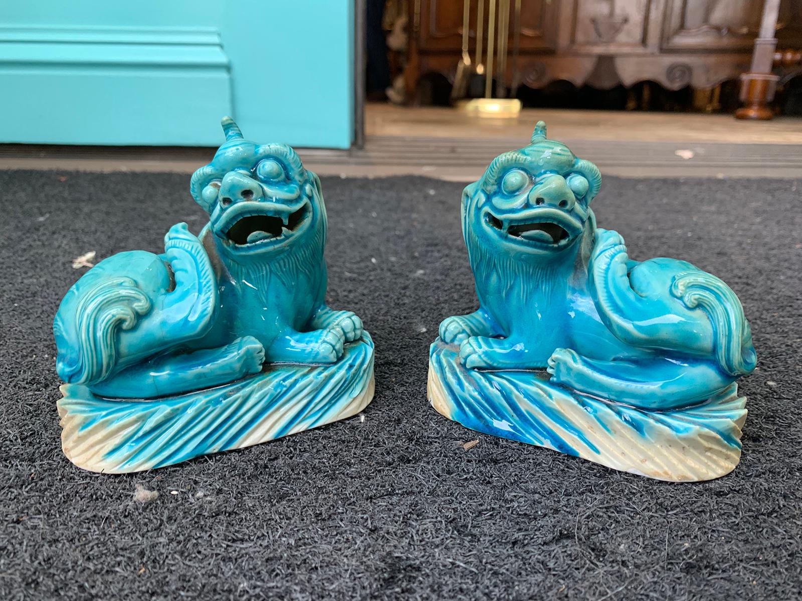 Pair of 19th century turquoise painted porcelain Foo dogs.