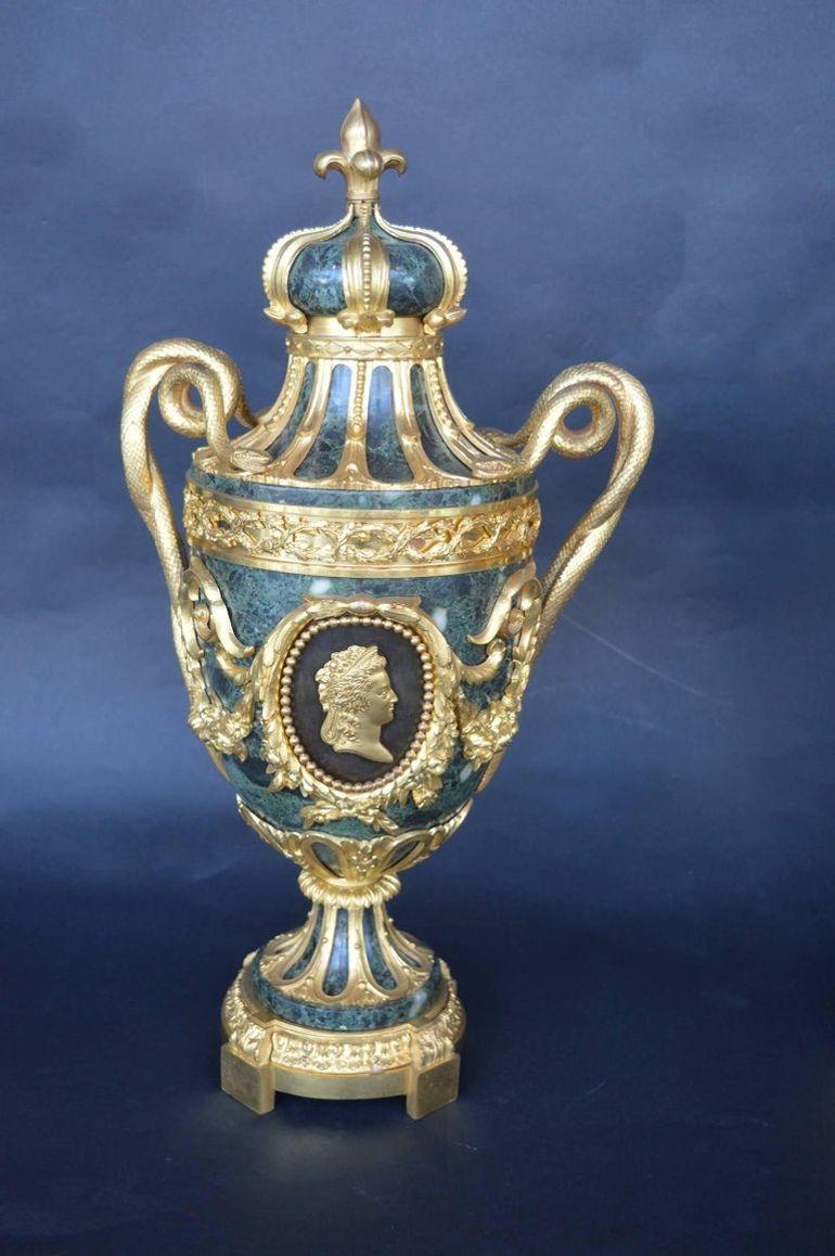 Pair of late 19th century green marble urns. The hand carving on the bronze is very well done and high end.