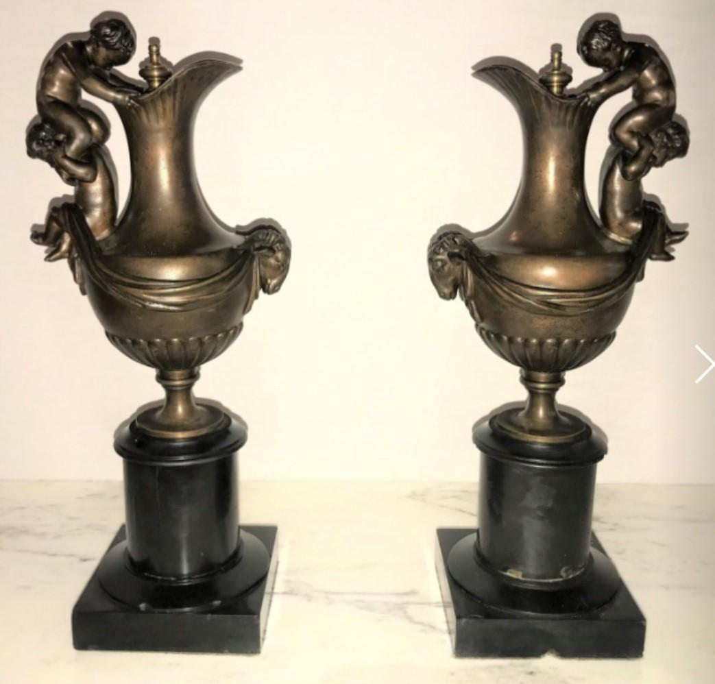 Pair of 19th Century Urns on Marble Stands Bearing Cherubs and Rams Heads For Sale 4