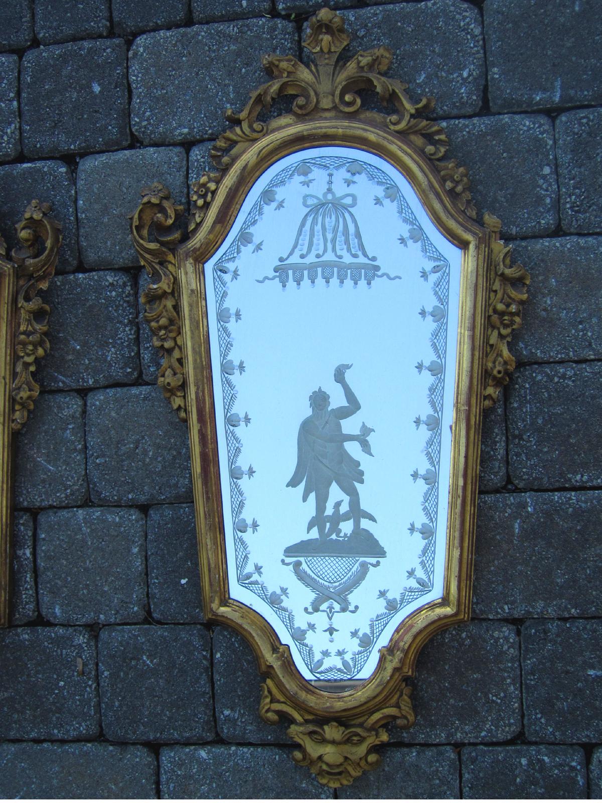 Pair of 19th century Venetian etched mirrors, Cartouche shape, with etched figure of man.