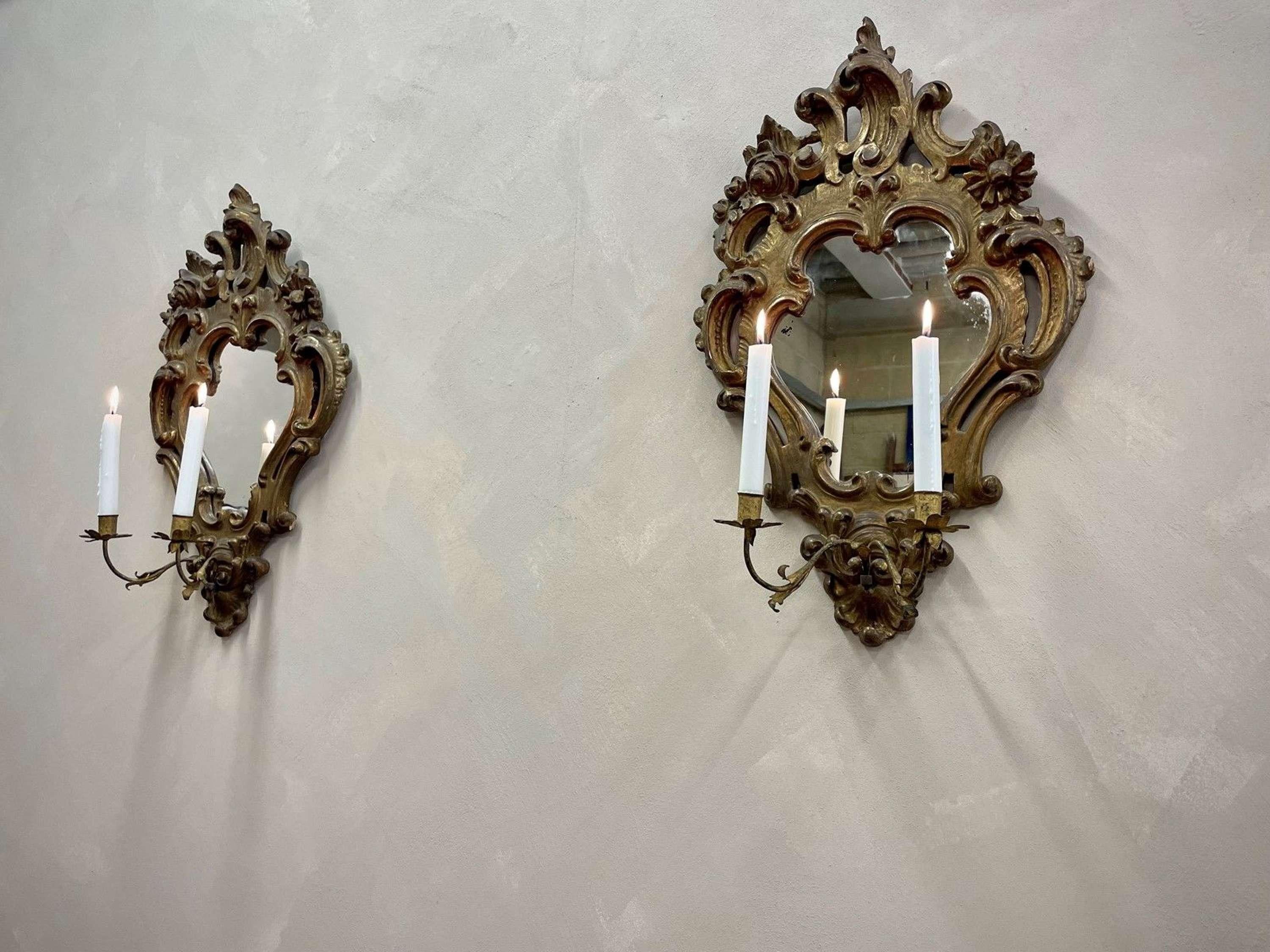 Pair of 19c, Venetian gilt mirror frames with detachable sconces. Later, 20c plate (c1910) with some light foxing. Beautiful and delicate foliate design details.
Some small losses to the Gilt as shown 
Height - 41.5 cm
Width - 33.5 cm
Inside