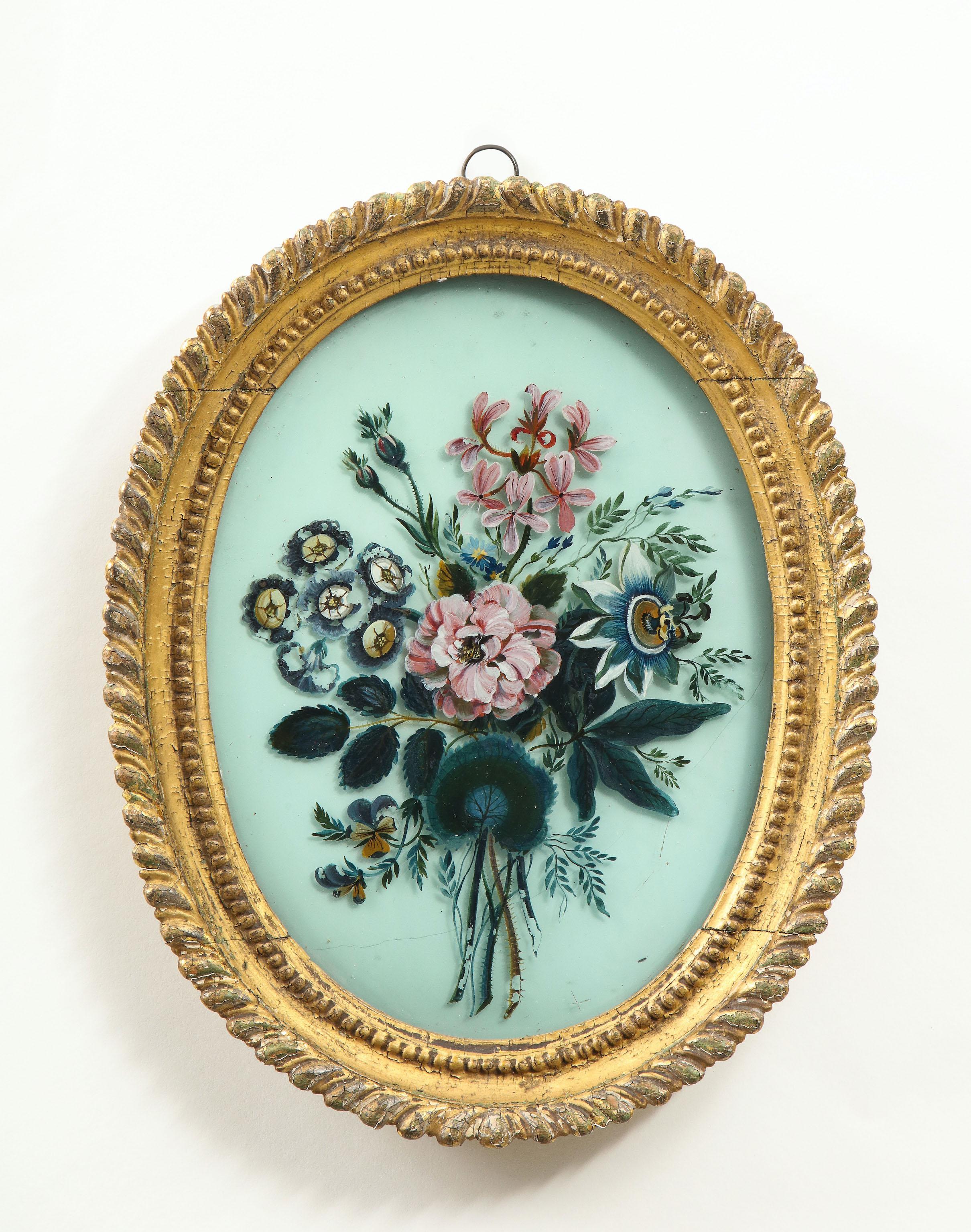 English Pair of 19th Century Verre Églomisé Oval Paintings of Floral Bouquets