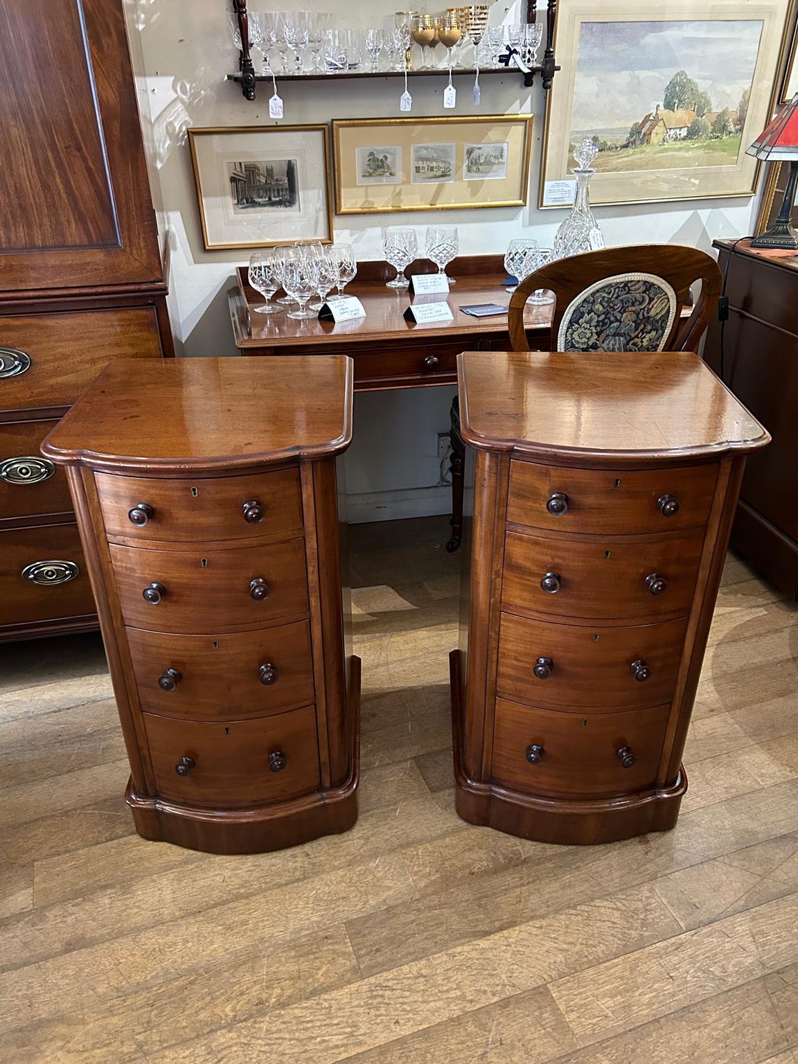 Pair of 19th Century Victorian Mahogany Shaped Bedside Tables with four fitted drawers and turned bun handles x2.

Circa: 1860

Dimensions:
Height:  30 inches – 76 cms
Width: 17 inches – 44 cms
Depth:  18 inches – 46 cms

Reference: BS2302