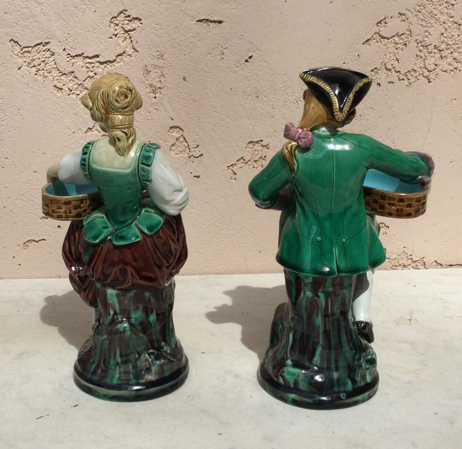 A charming pair of Victorian Majolica couple dressed holding a basket.
End of 19th century.
Signed Minton and designed by Albert Ernest Carrier Belleuse.