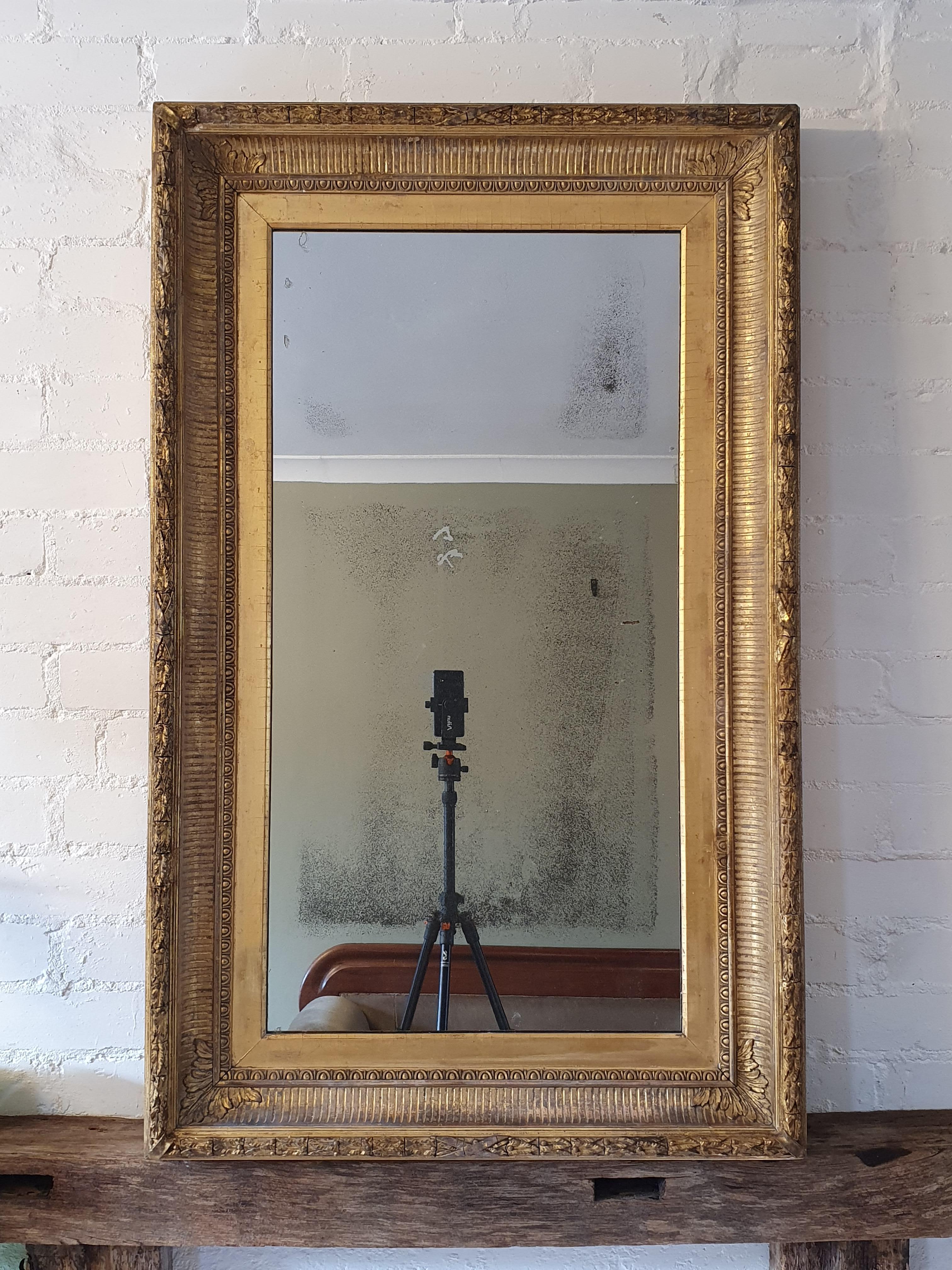 Pair of 19th century English wall mirrors, in neoclassical style. They have original gilding and mercury glass plates ( with some foxing and scratches typical for age). Frames can be positioned vertically or horizontally.
   