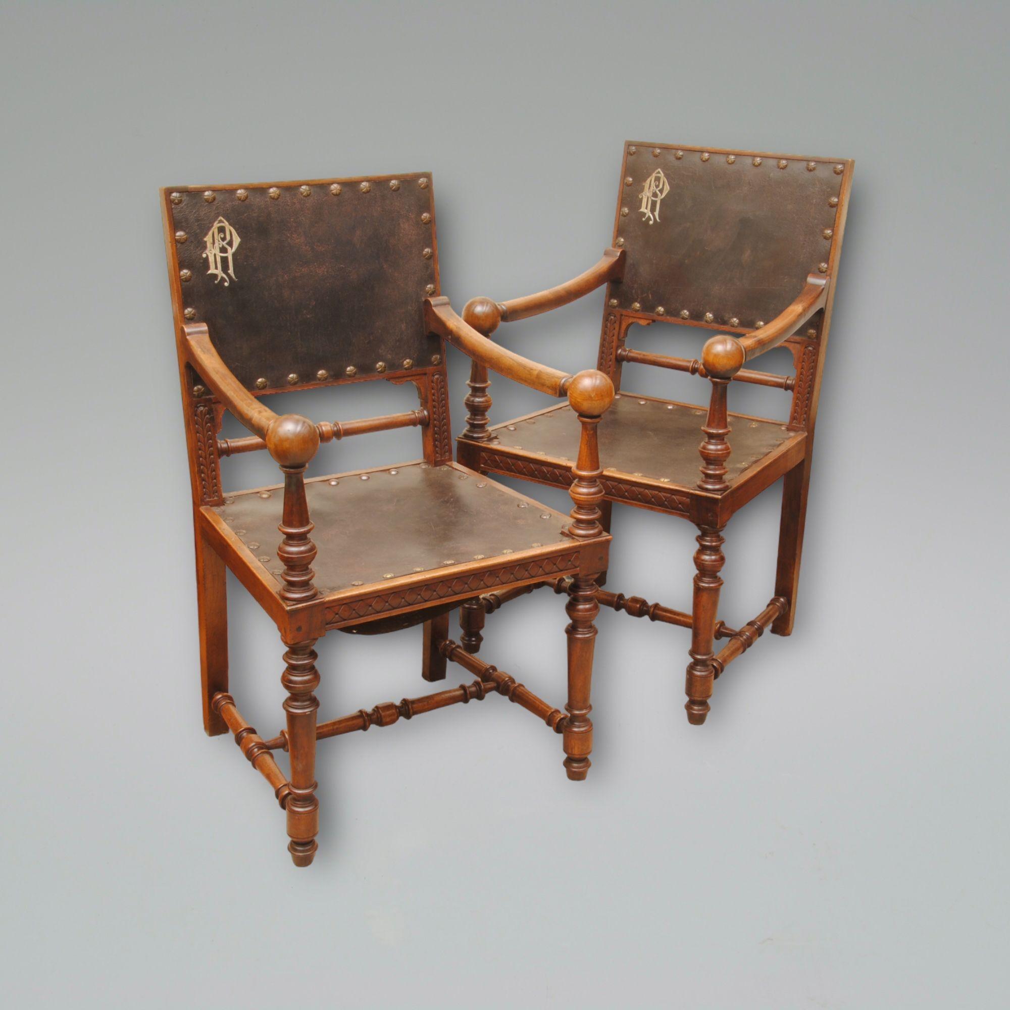A pair of walnut and leather upholstered French armchairs with turned legs and balls at the end of the arms, good colour, and patina.
Circa 1850