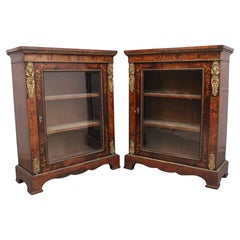 Pair of 19th Century walnut pier cabinets by Edwards & Roberts