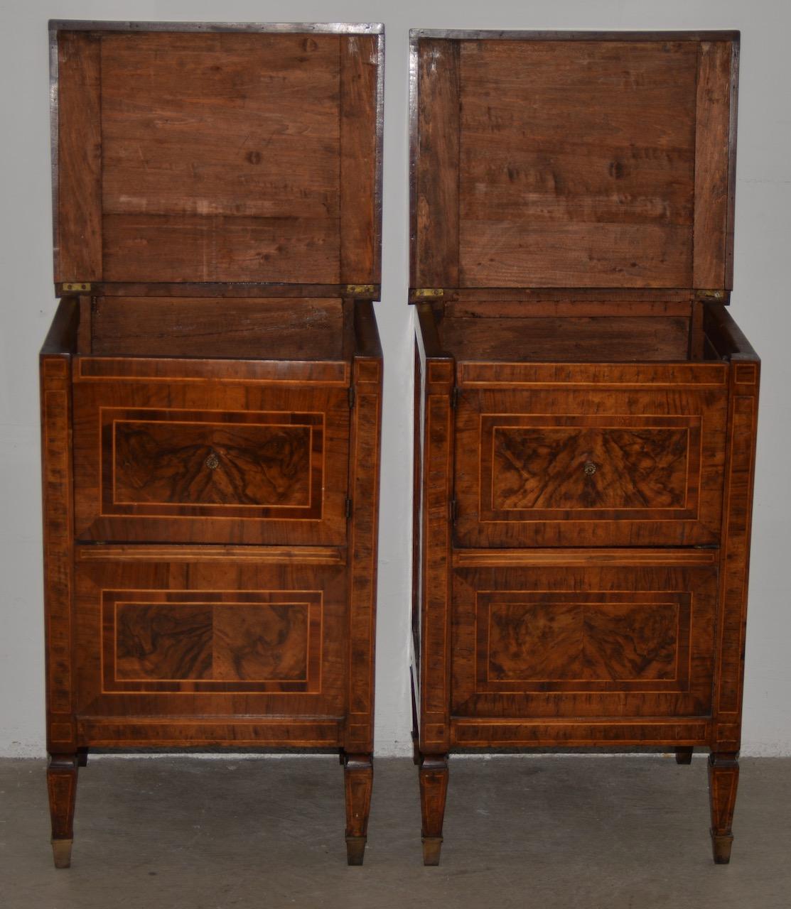 Pair of 19th century walnut side tables with cabinets

These beautiful side tables with inlay have a rich patina that can only come with age. The tapered feet are capped with brass.

The cabinets have a lower cupboard for hidden