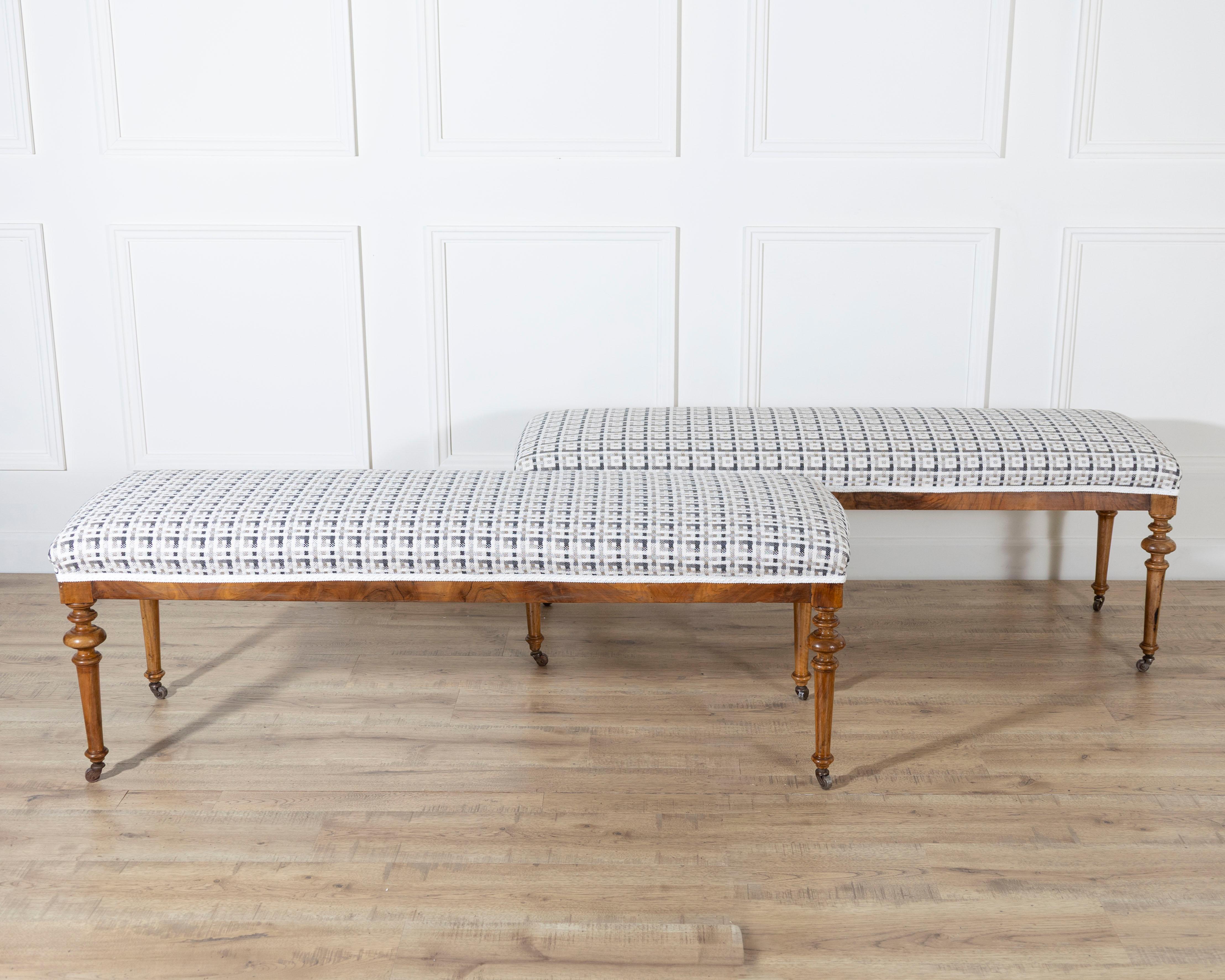 Italian Pair of 19th-Century Walnut Upholstered Benches with Turned Legs and Casters For Sale