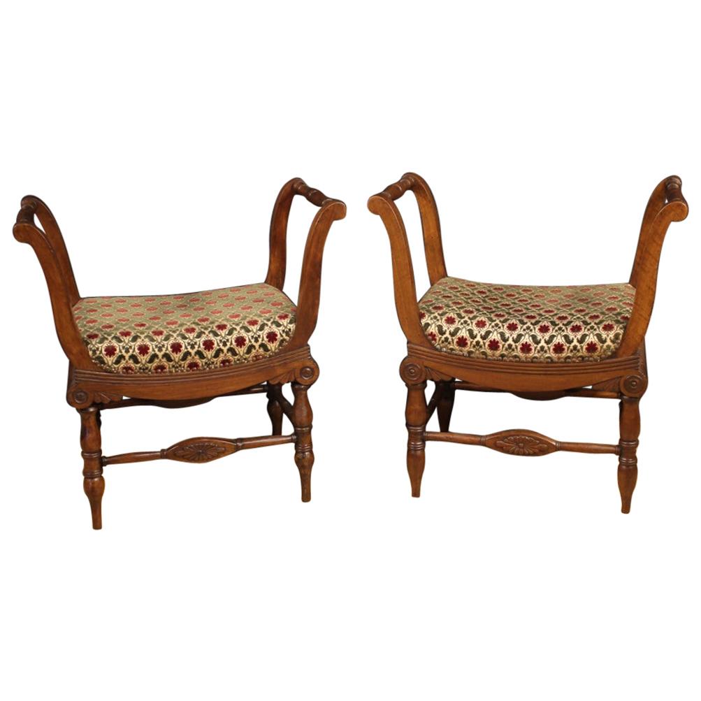 Pair of Italian benches from the Charles X era. Furniture carved in walnut with seats covered in fabric with floral decorations (not original, replaced during the 20th century). Benches of beautiful lines and pleasant decor, finely chiseled, they