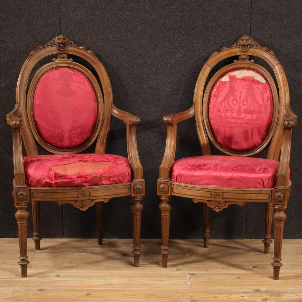 Pair of Genoese armchairs from the mid-19th century. Furniture carved in walnut wood of Louis XVI line finely chiselled with feral ornament in the upper part (see photo). Armchairs for antique dealers and interior decorators, ideal to be placed in a