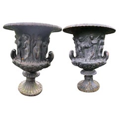 Pair of 19th Century Weathered Cast Iron Urns