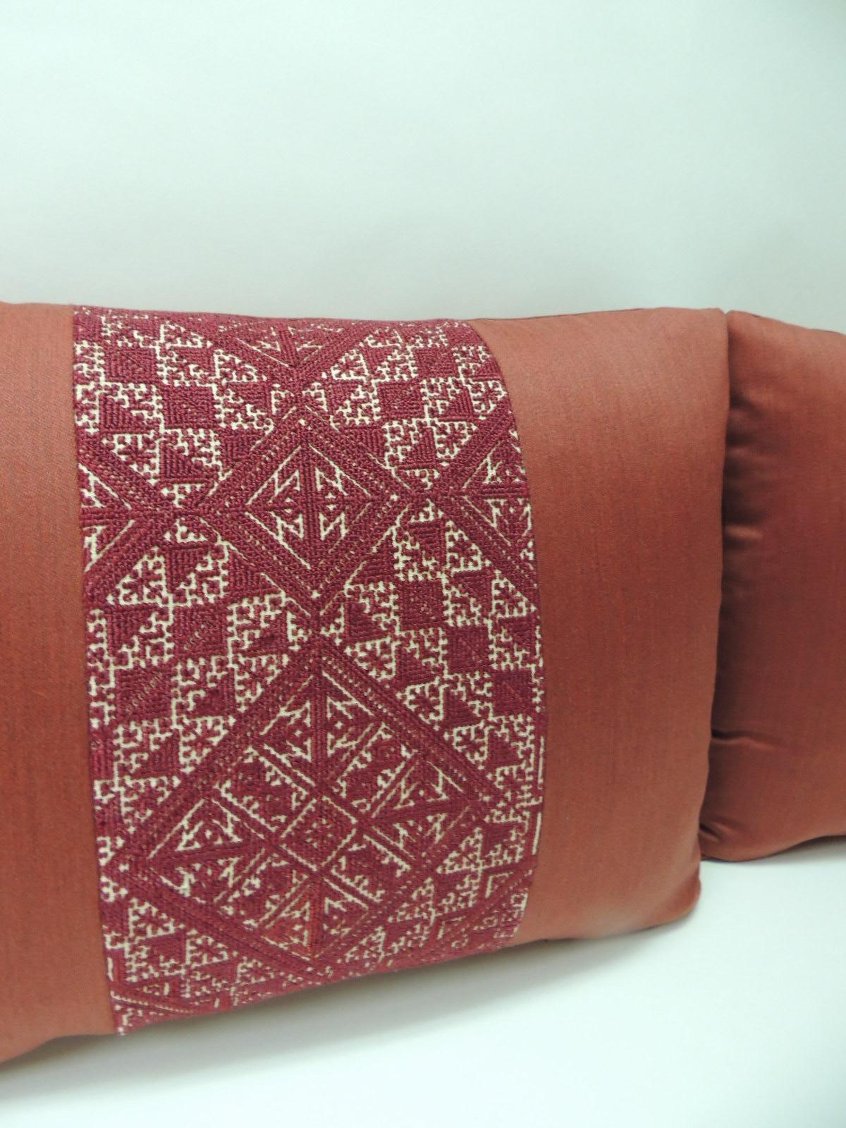 Pair of 19th century woven red fez textile bolster decorative pillows
Antique red Fez textile pair of bolster decorative pillows hand-stitched. Traditional antique Fez textile embroidery red silk hand-stitched onto red cashmere frames and backings.