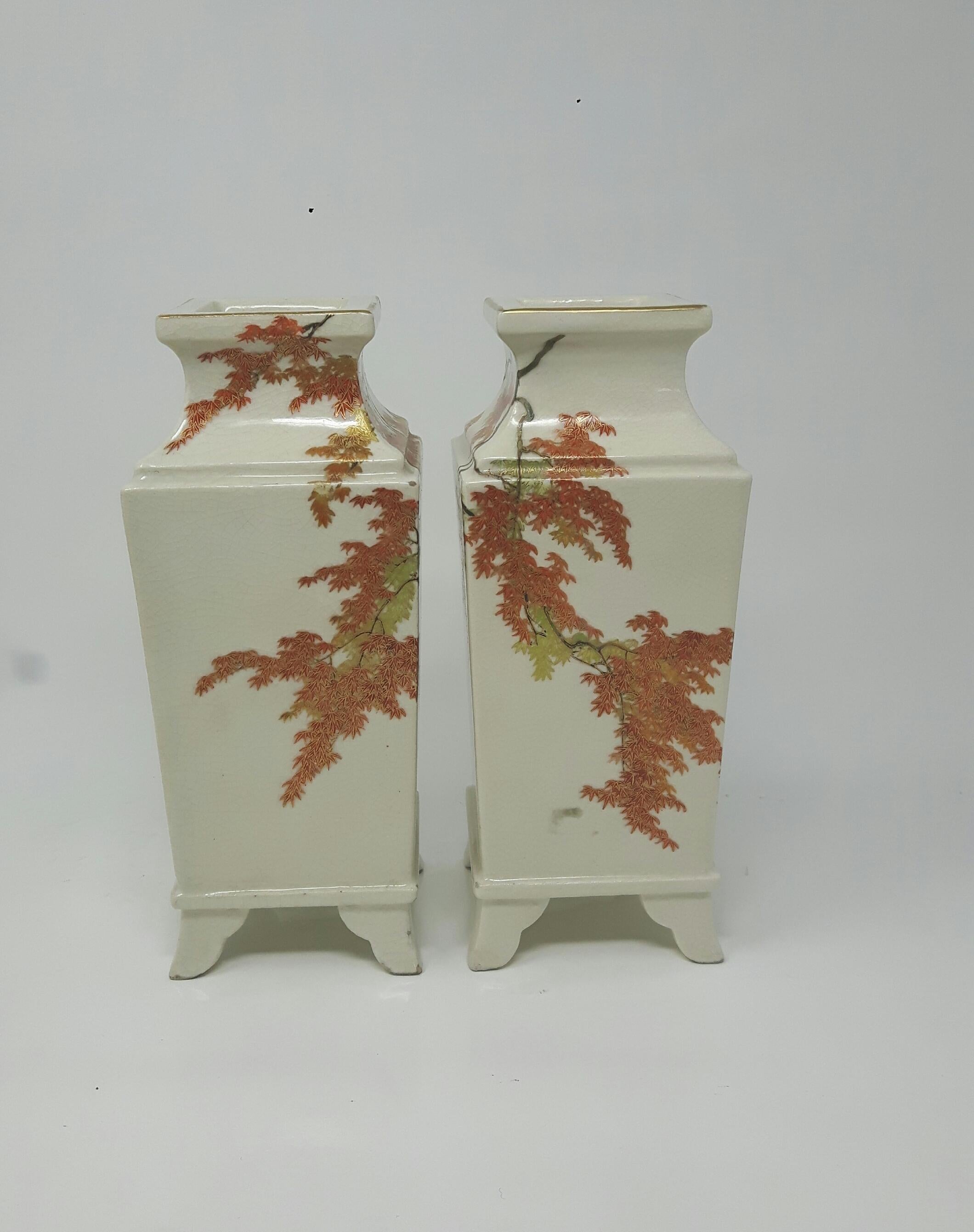 A pair of satsuma square vases. Each vase raised on four bracket feet, finely enamelled to the exterior in red, green, brown and gilt with maple tree branchs, signed Yabu Meizan.