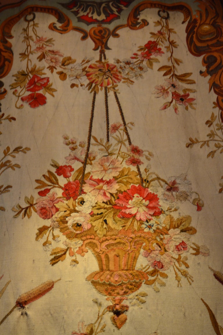 A pair of French Aubusson tapestries woven in the mid-19th century. Originally intended to hang between windows in a formal French salon, but today could be hung on walls anywhere. Where symmetry is desired. Their design is of 18th century origin