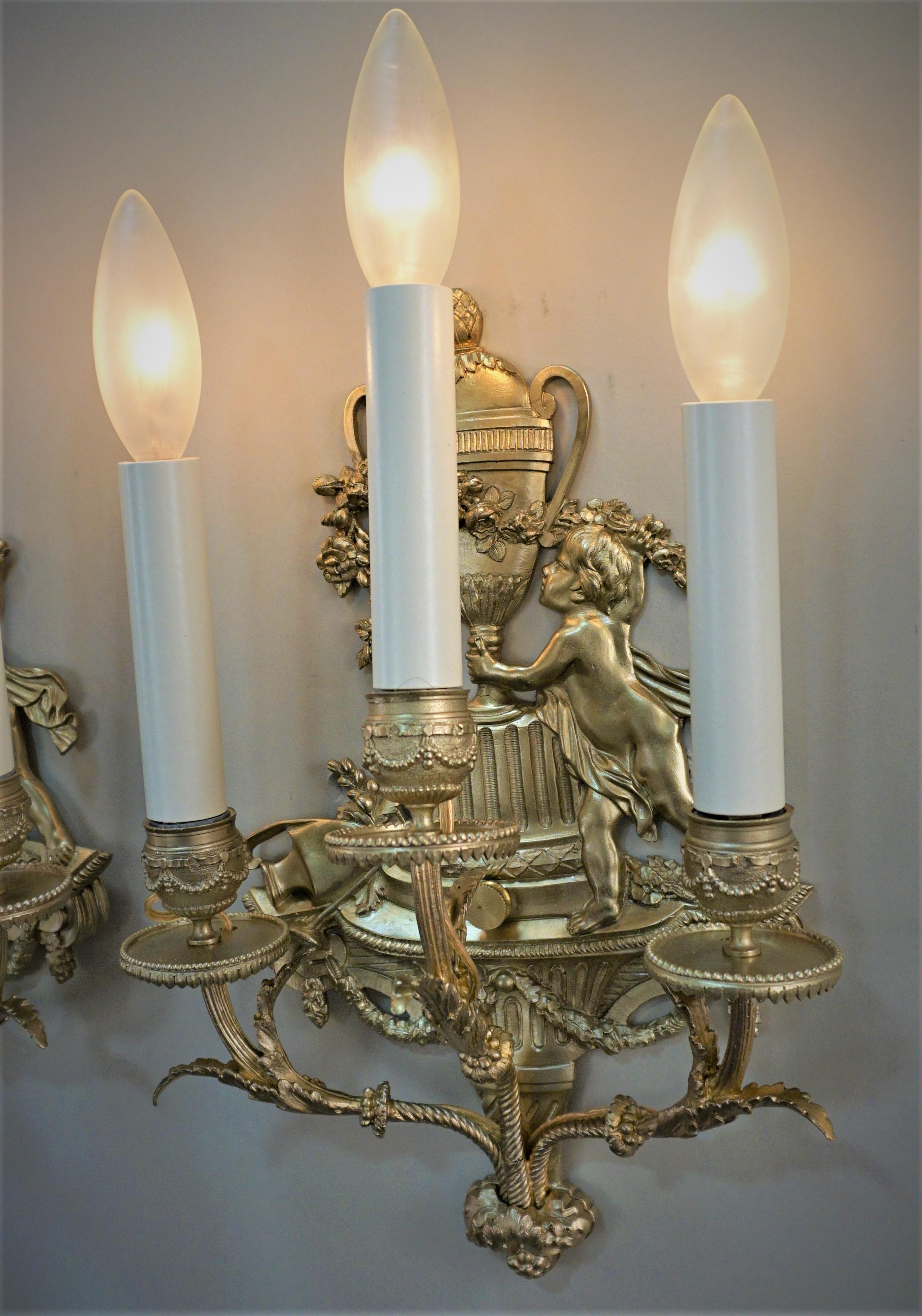Pair of 19th century candle burning wall sconces that have been professionally electrified and ready for installation.