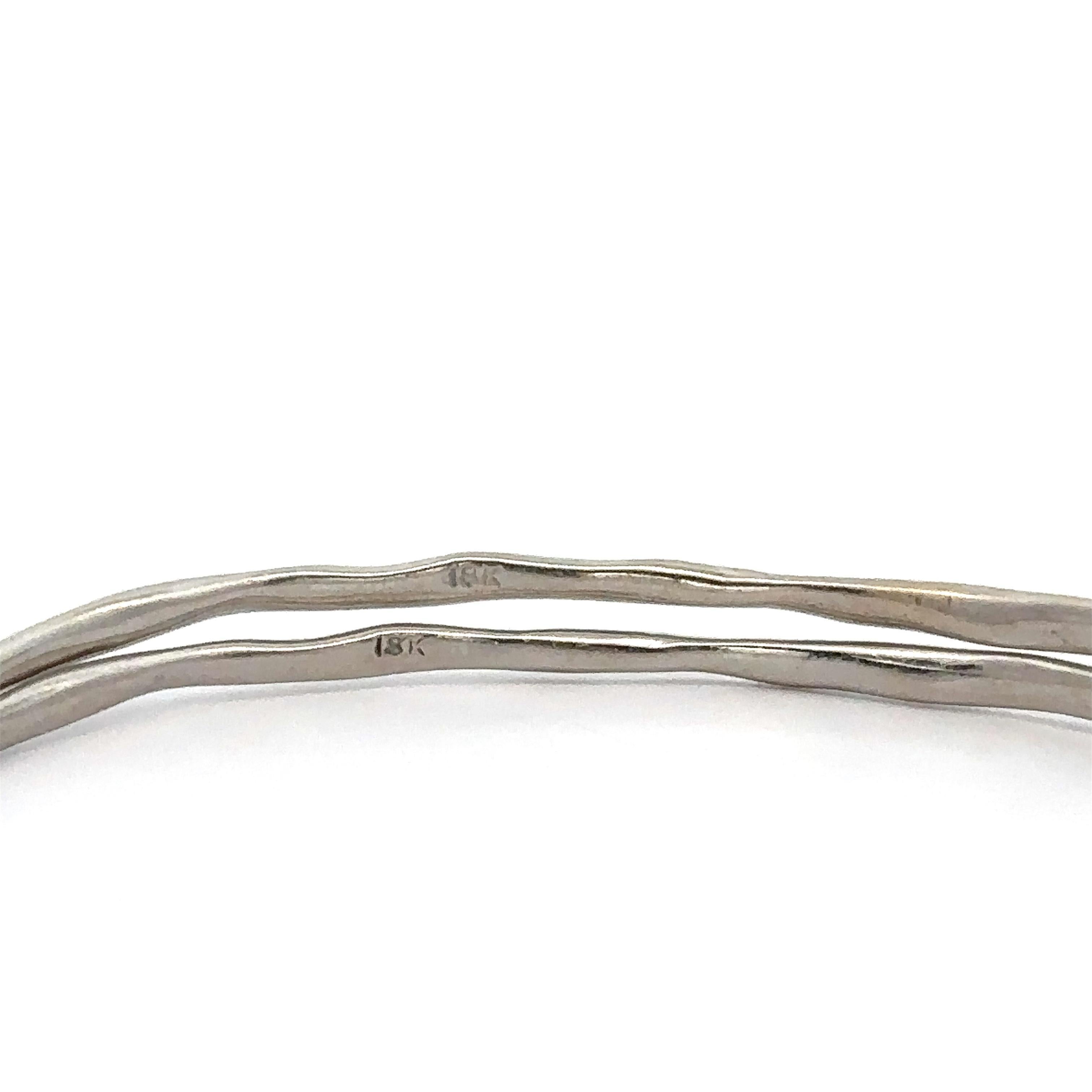 --Stone(s):--
(4) Natural Genuine Diamonds - Round Brilliant Cut - Bezel Set - Very Nice Clean White Color - 0.14ctw (approx.)

Material: Solid 18K White Gold
Weight: 15.31 Grams (weight of the pair)
Type: Pair of 2 Slip On Bangle Bracelets
Inner