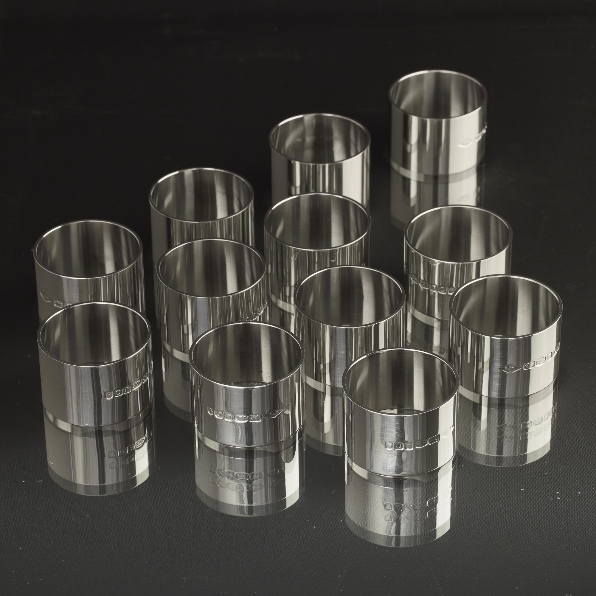 A set of 12 simple, heavy-gauge silver napkin rings, each weighing more than two troy ounces (62 g). Their simplicity provides a canvas for personalising by engraving initials, crests or any other imagery.
 
 Contact us for advice and further