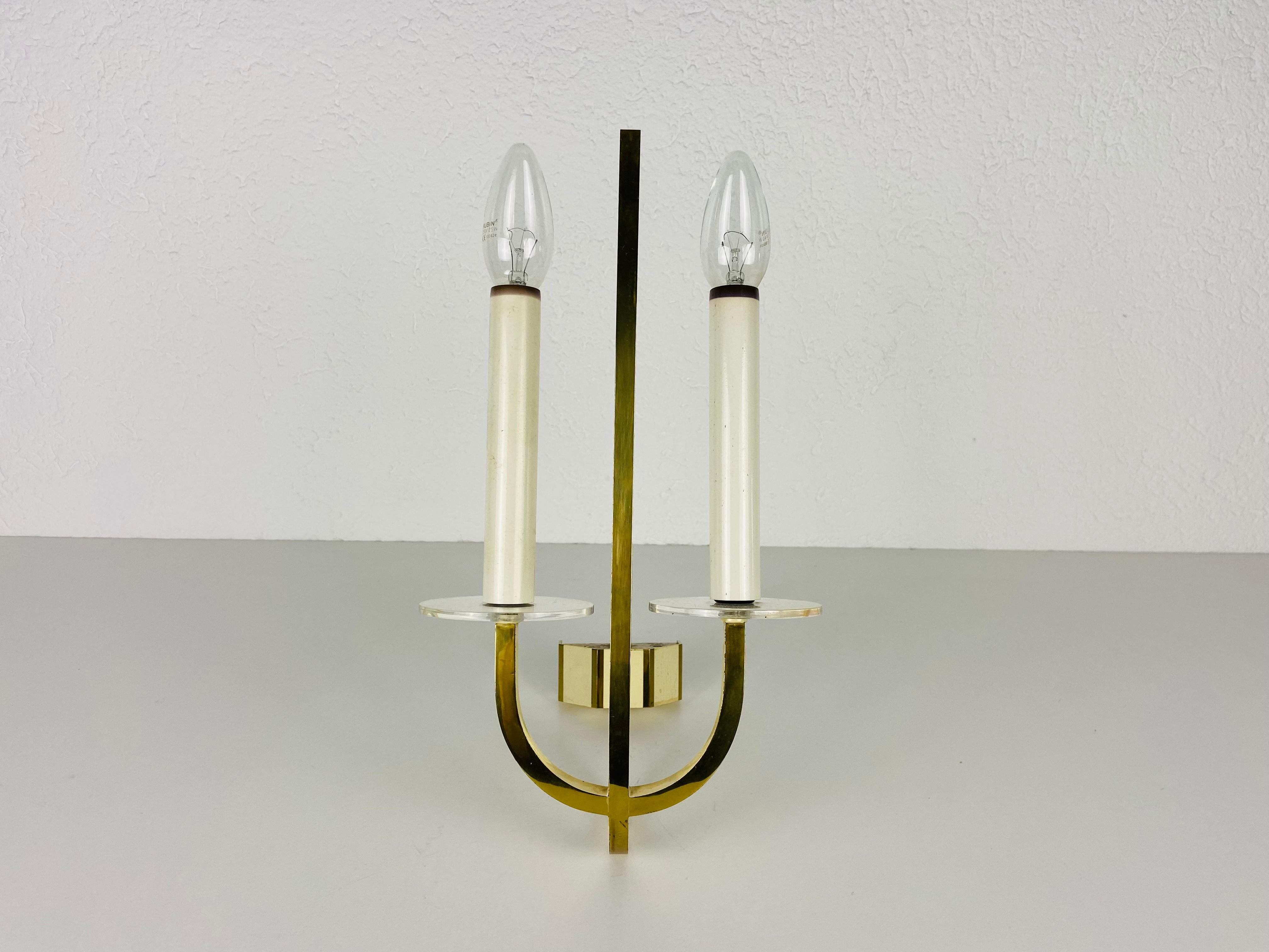 Brass and glass sconces made in Germany in the 1960s. The lamps are in a very good condition.

The lights require E14 light bulbs. Works with both 120/220V. 

Free worldwide express shipping.