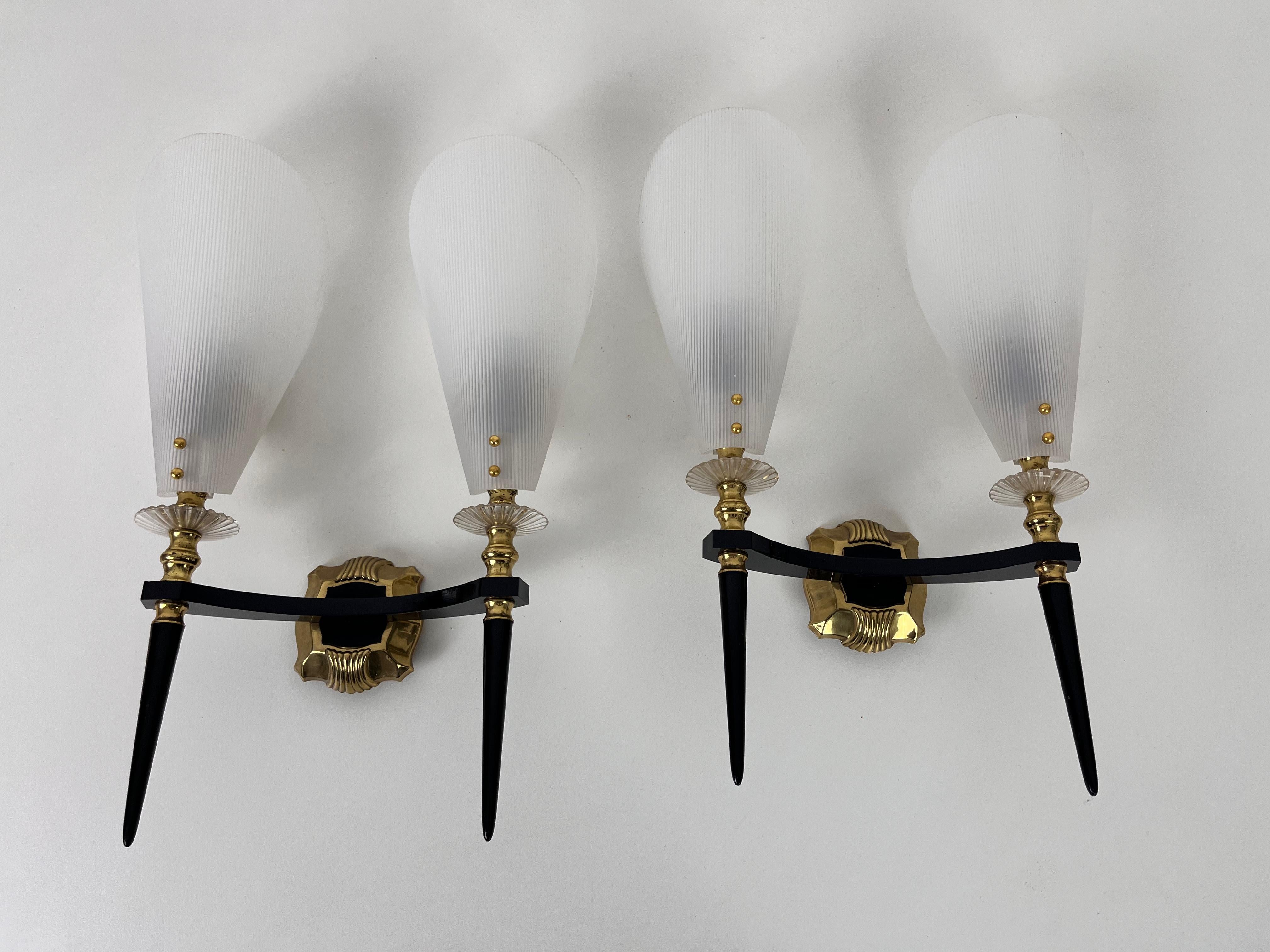 Maison Arlus sconces made in France in the 1960s. The body is made of plastic with beautiful brass ornaments. The shades are plexi glass.

Works with both 120/220V. Good vintage condition. 

Free worldwide express shipping.