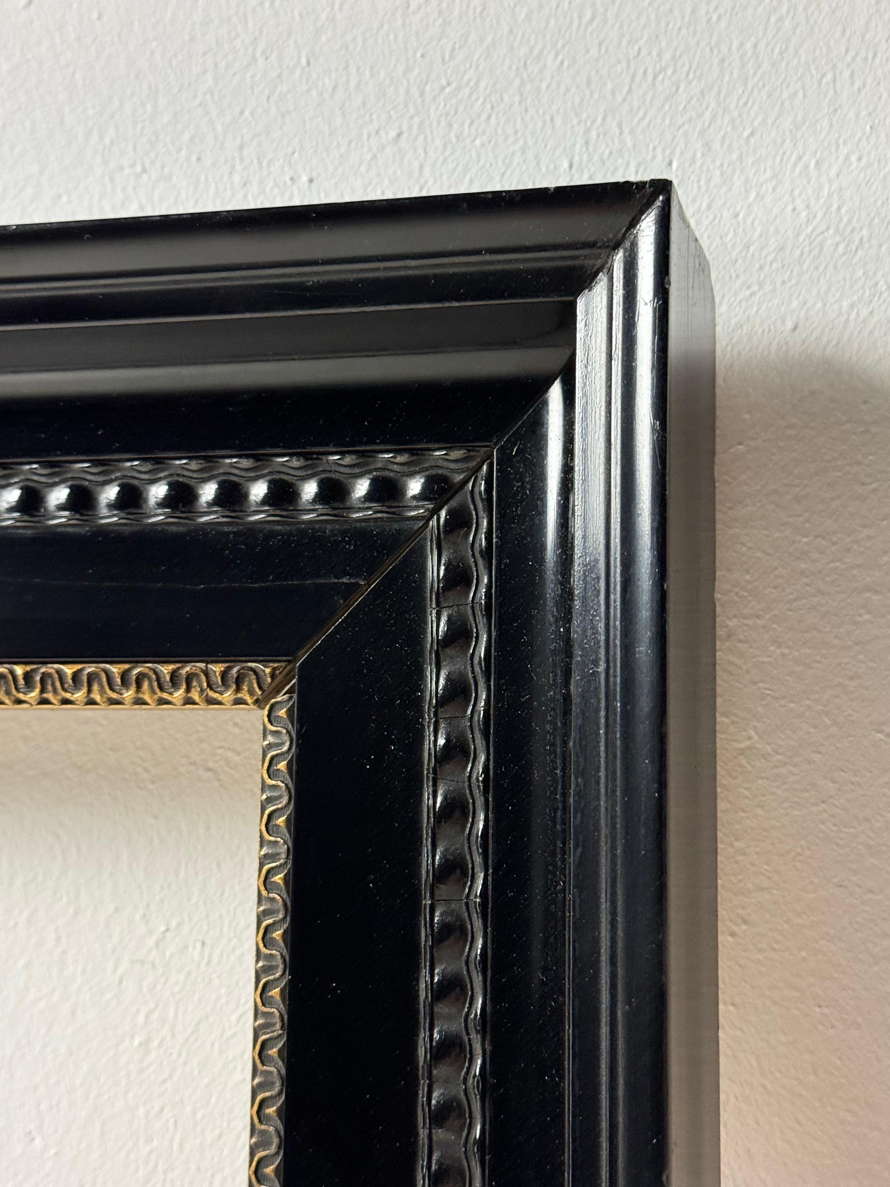 Set of 2 very neat black frames. Original from the Netherlands, c. 1900. Finished with gold trim inside.

Dimensions: 75H x 54W x 5D