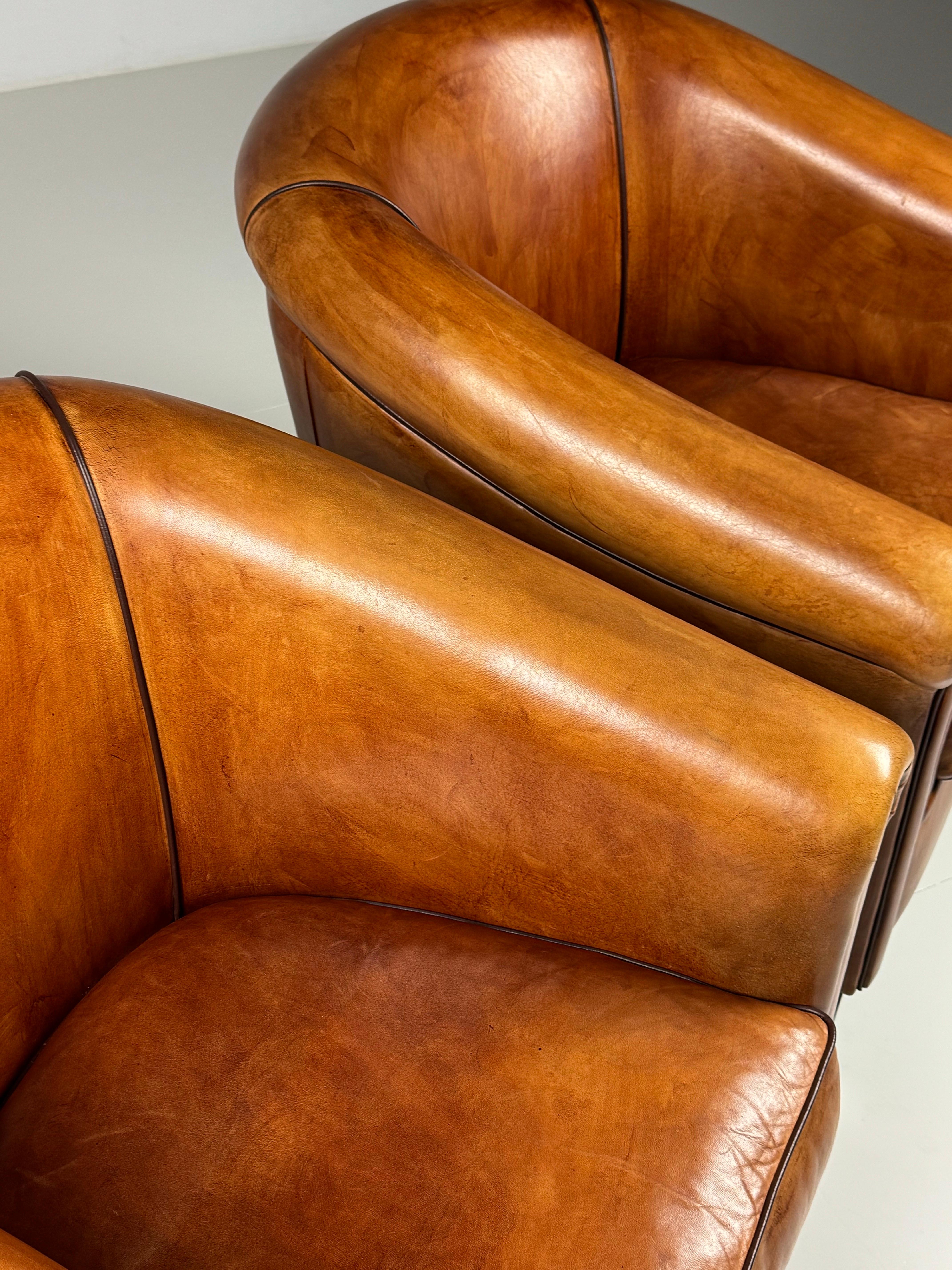 Set of 2 sheep leather club chairs / armchairs. In absolute new condition! Beautiful colour and patina.

Dimensions: 76W x 80D x 83H
48sh