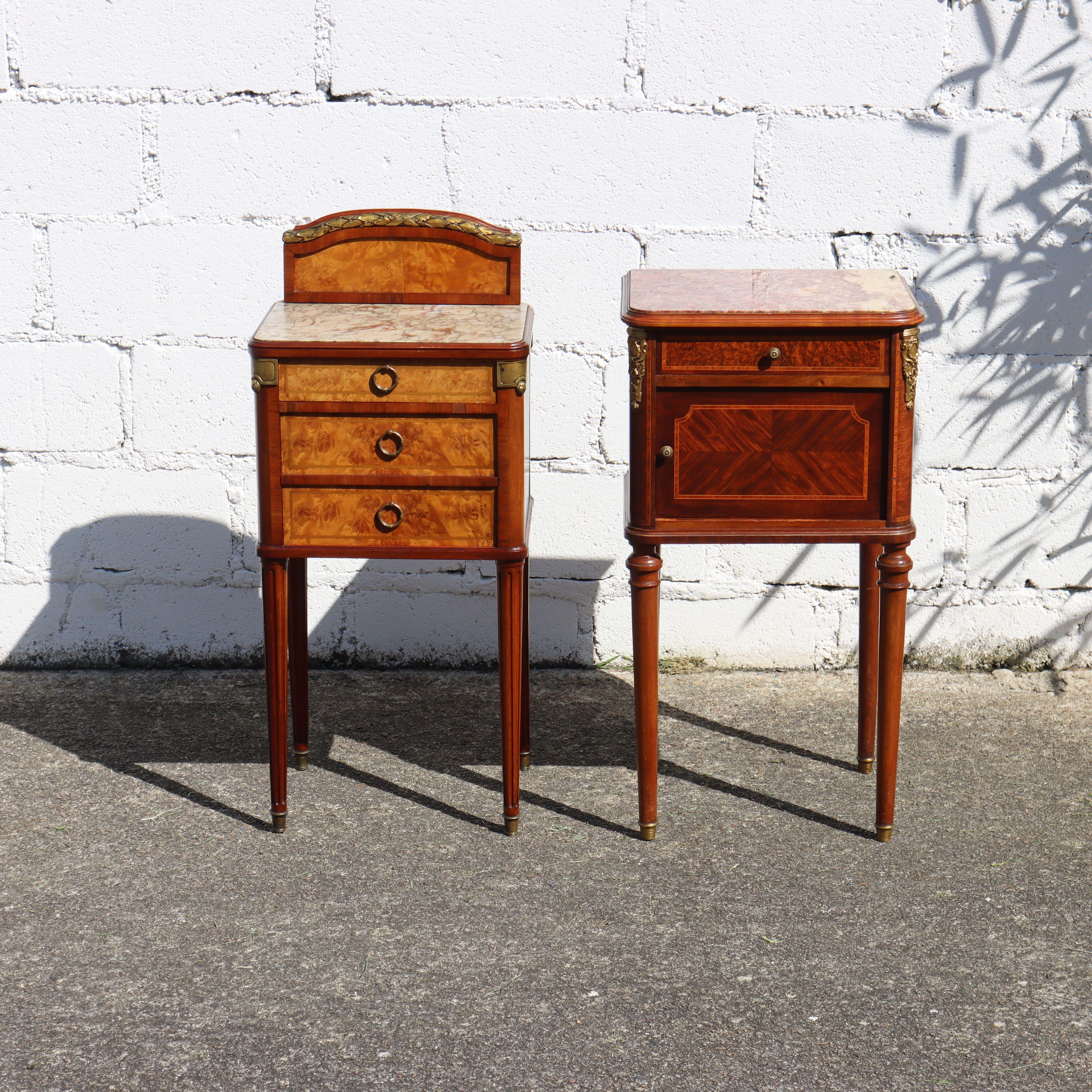 Pair of 2 French Antique Louis XVI Rosewood Marquetry Marble Top Nightstands from the 20s
2 different Cabinet Maker Masterpieces , which we offer as a Pair.

1) Solid Mahogany Bedside Table with high-quality Marquetry on the Front and both Sides and