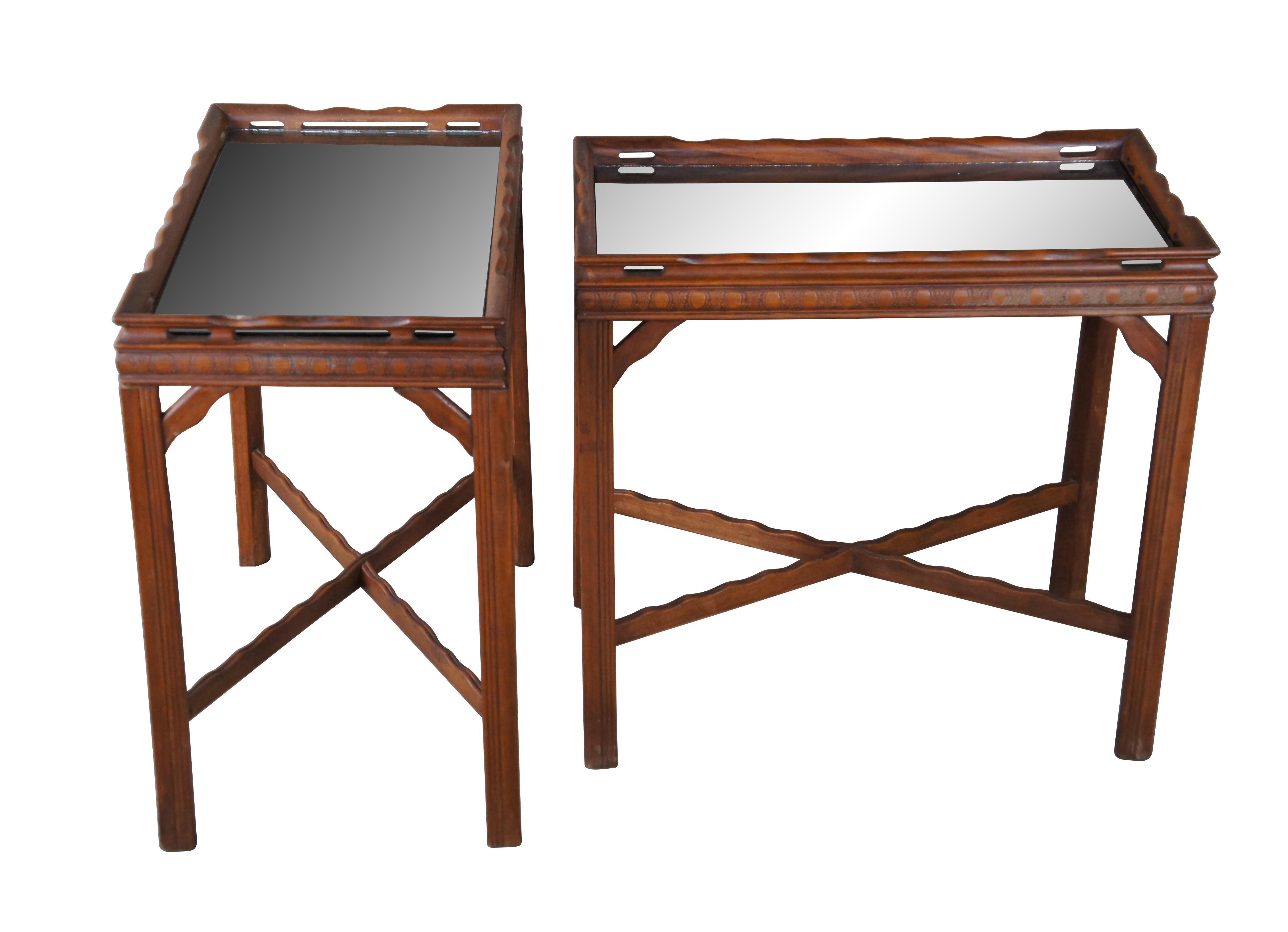Pair of two George III / Chippendale style side tables.  Made of mahogany featuring a reticulated gallery tray style top with inset glass, egg and dart molding, fluted legs and serpentine x stretcher.

Dimensions:
23 1/4