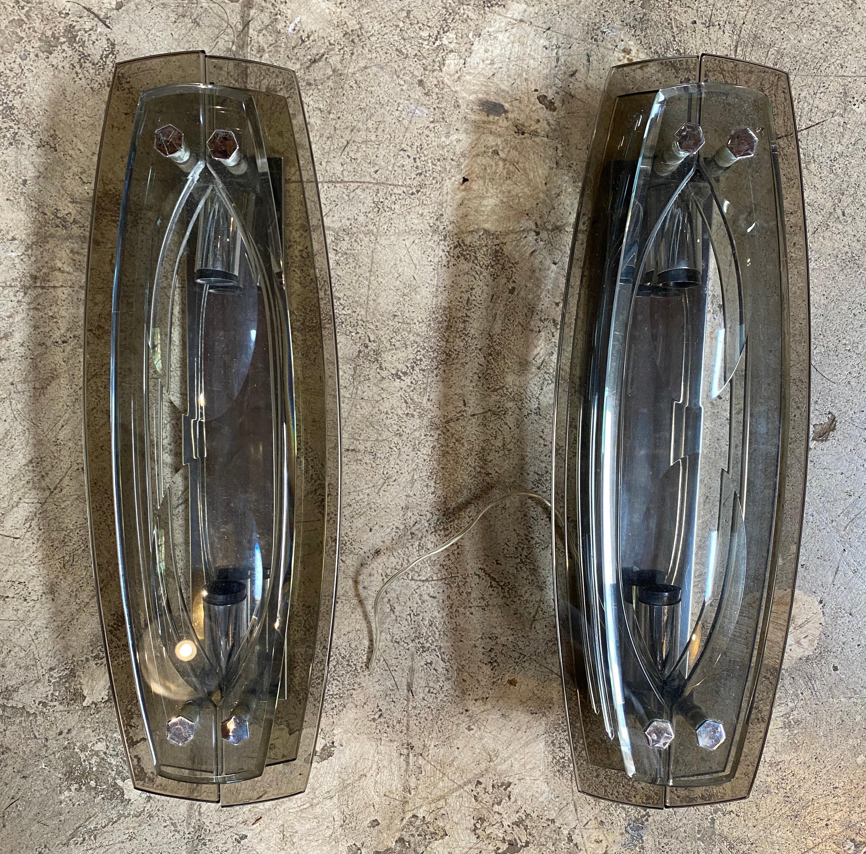Beautiful pair of 2 veca Italian double glass wall sconces made with glass and chrome details. An elegant and simple item that will complete a midcentury living room or study.
 