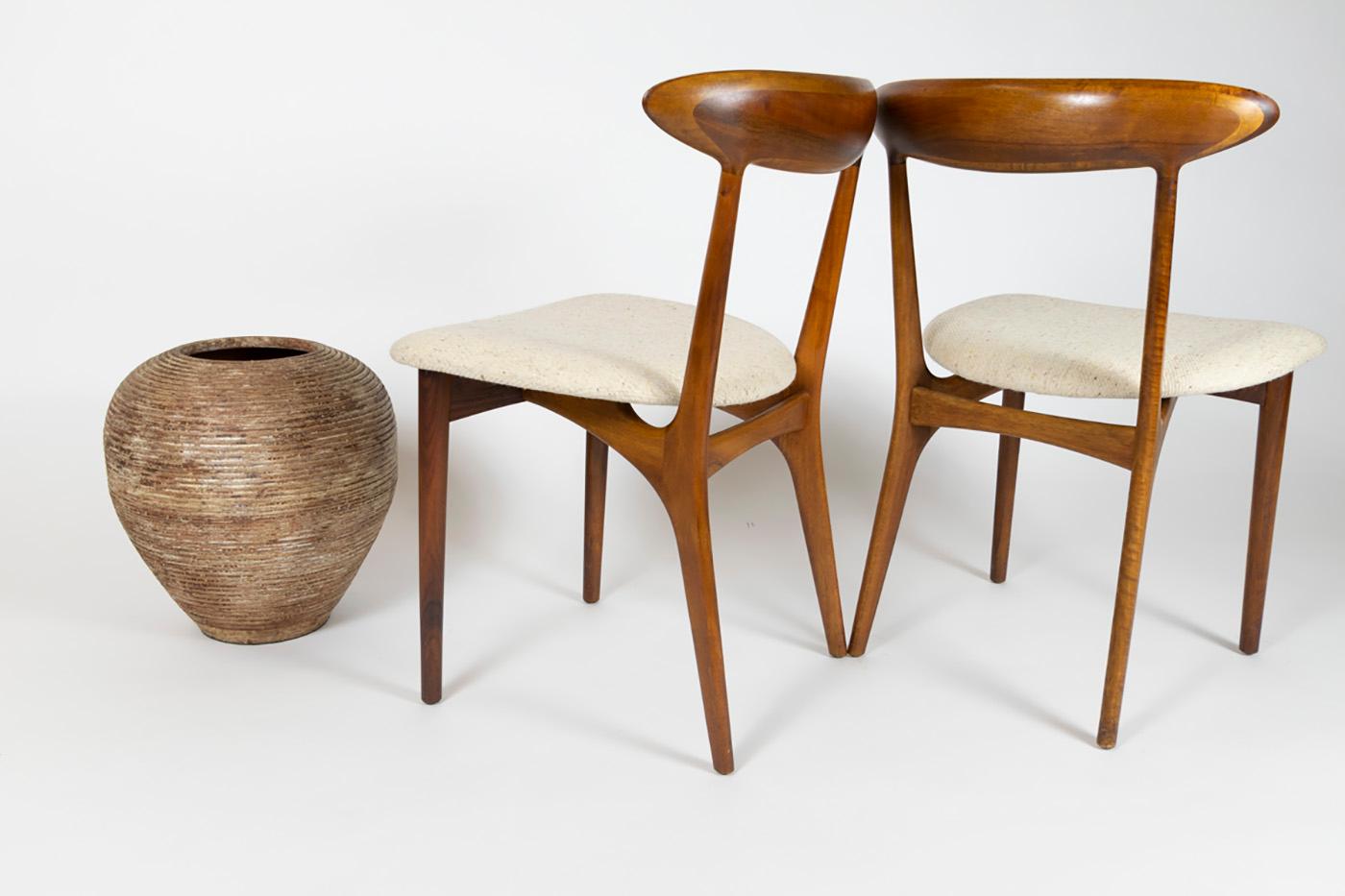Danish modern design at it’s best. 

Pair of 2 dining chairs designed by Kurt Ostervig for Brande Mobelfabrik will turn your house in to an art studio.
Elegantly contoured, the backrest on the side chairs blends in smoothly with the supports, no