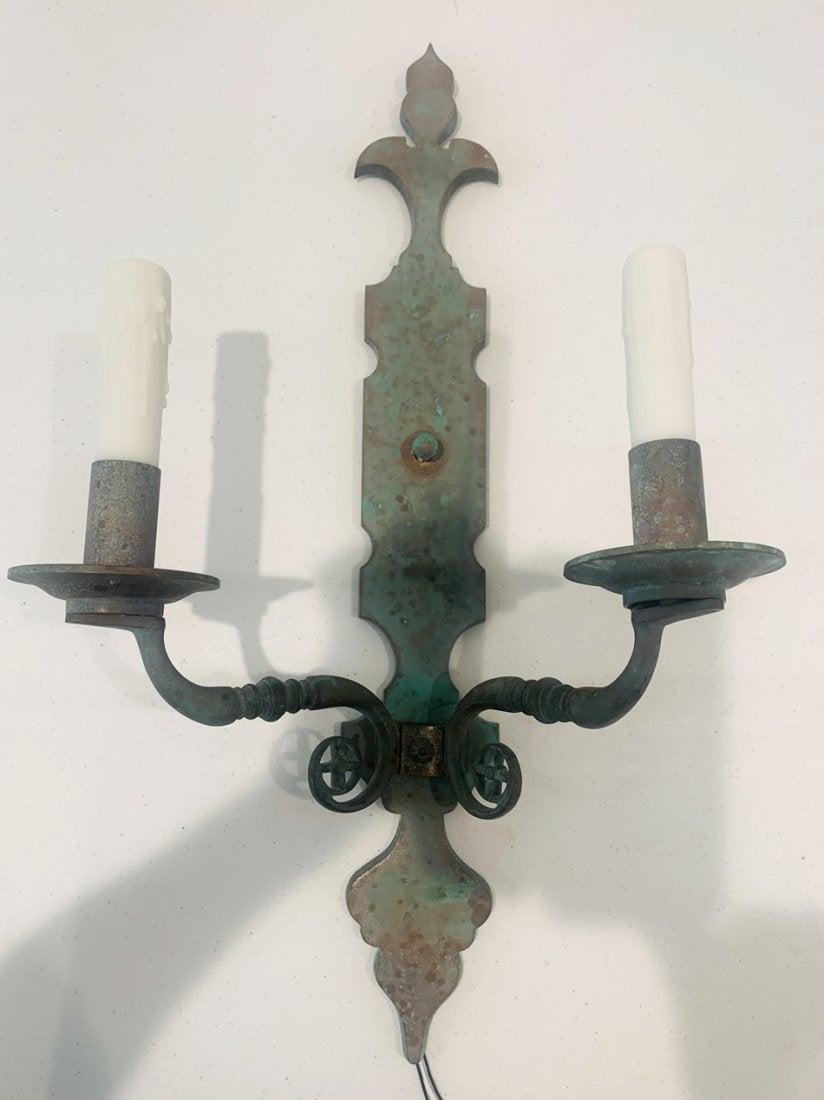 Beautiful pair of copper sconces designed and manufactured in the USA.
The pieces are well made, each sconce comes with two wax candle sleeves lights and they have a beautiful verdigris patina.

Measurements:

24 inches high x 12 inches wide x