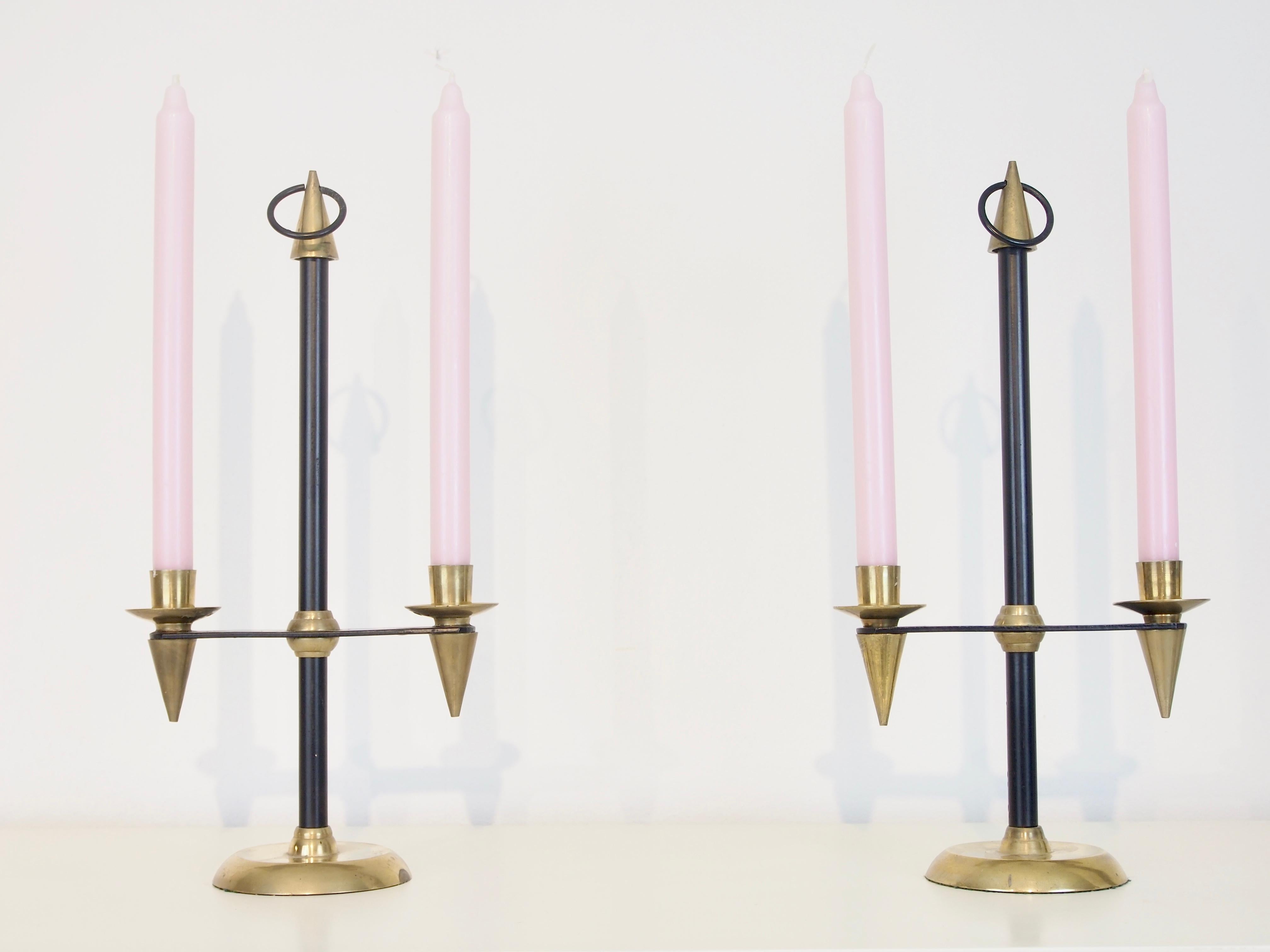 Stunning pair of 2 vintage brass/metal midcentury Gio Ponti style candlesticks.

Condition: In good vintage condition; patin and some corrosion spots conform its age. 
Please look closely to all pictures they're substantially part of the