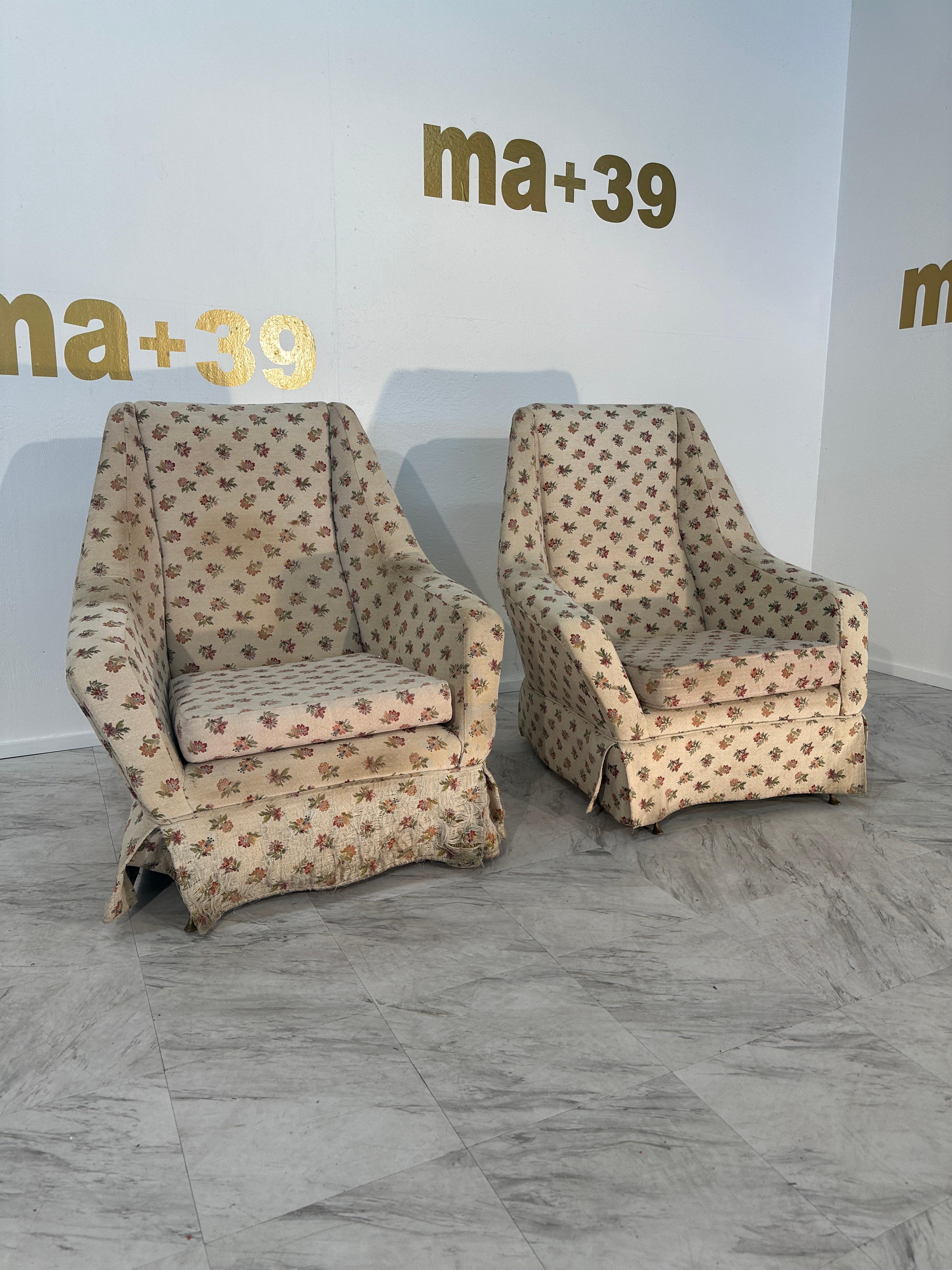 The Pair of 2 Mid Century Italian Armchairs from the 1960s showcase a distinctive and unique design, making them stand out as statement pieces. The chairs feature a brass frame, adding a touch of opulence and sophistication to their aesthetic. What