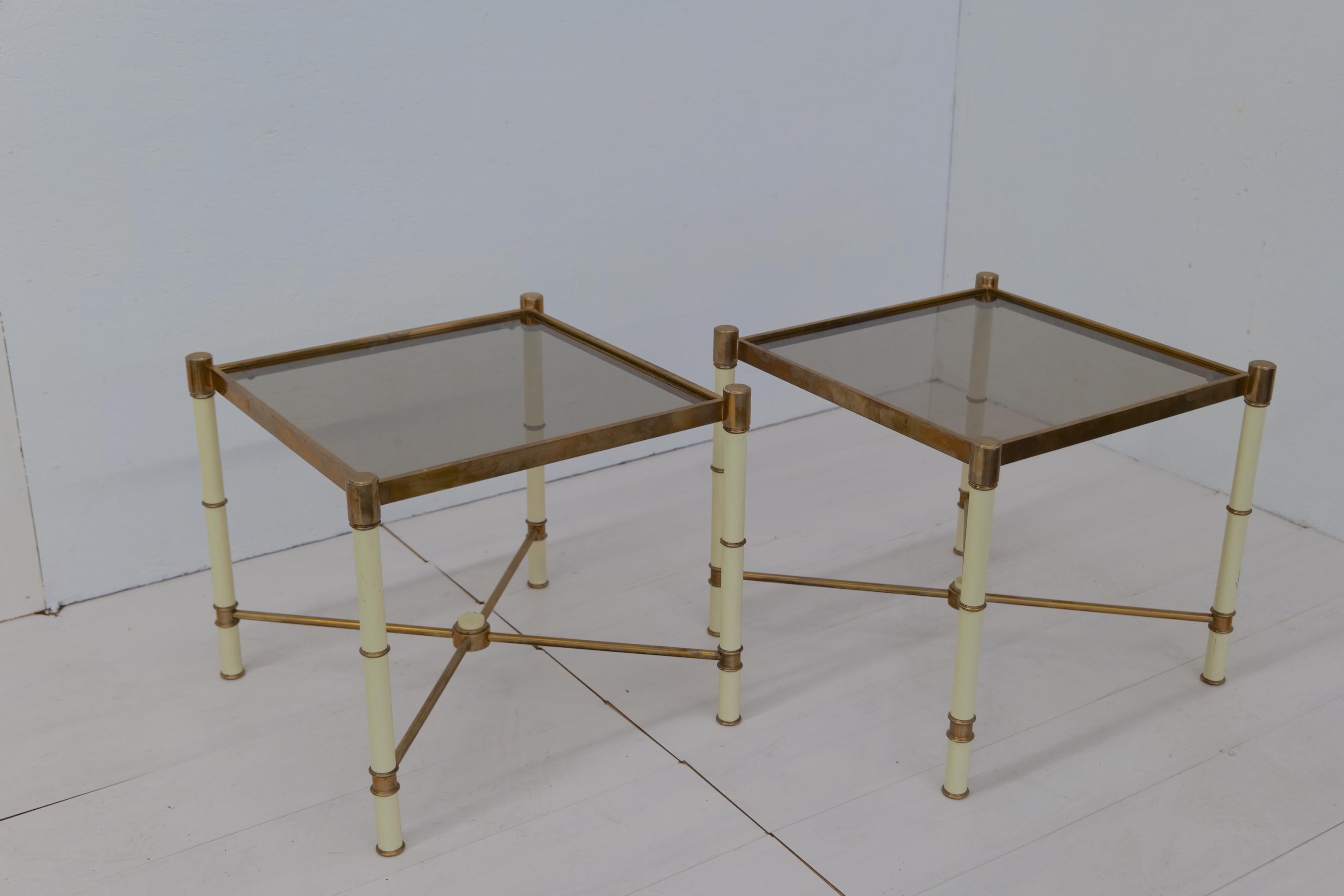 The Pair of 2 midcentury Side Tables from the 1980s is a stylish set that embodies the essence of midcentury design. With their sleek lines and timeless appeal, these tables offer both functionality and aesthetic charm. The perfect addition to any