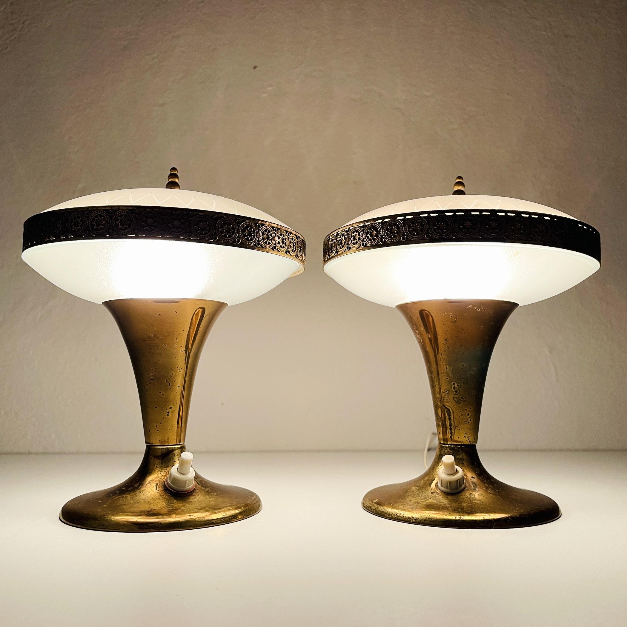 The pair of charming table lamps made in Italy in the 50s. Their beautiful color and light patina give them grace and charm. These table lamps will fit in the bedroom, nursery, and living room. Requires standard E14 bulbs. Bulbs are not included.