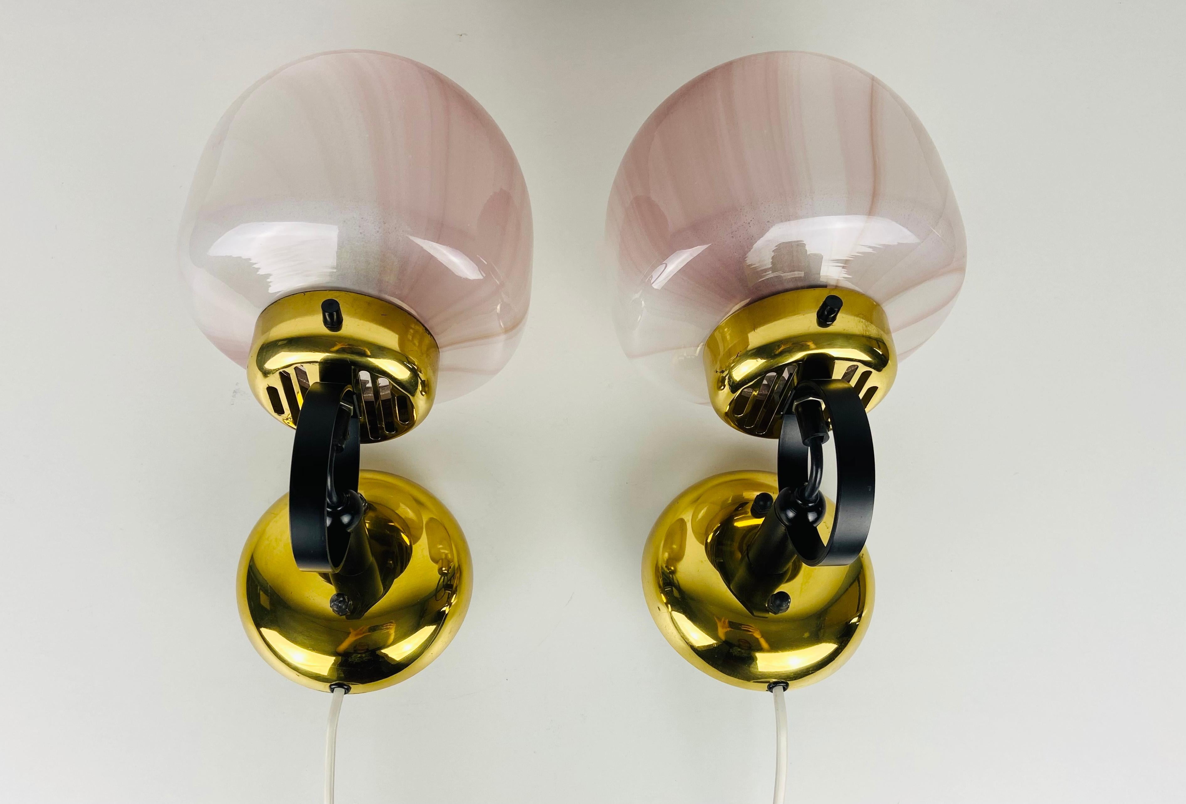 Peill & Putzler sconces made in Germany in the 1970s. White and pink opaque glass with brass elements. The lamps are in a very good condition.

The lights require E14 light bulbs. Works with both 120/220V. 

Free worldwide shipping.