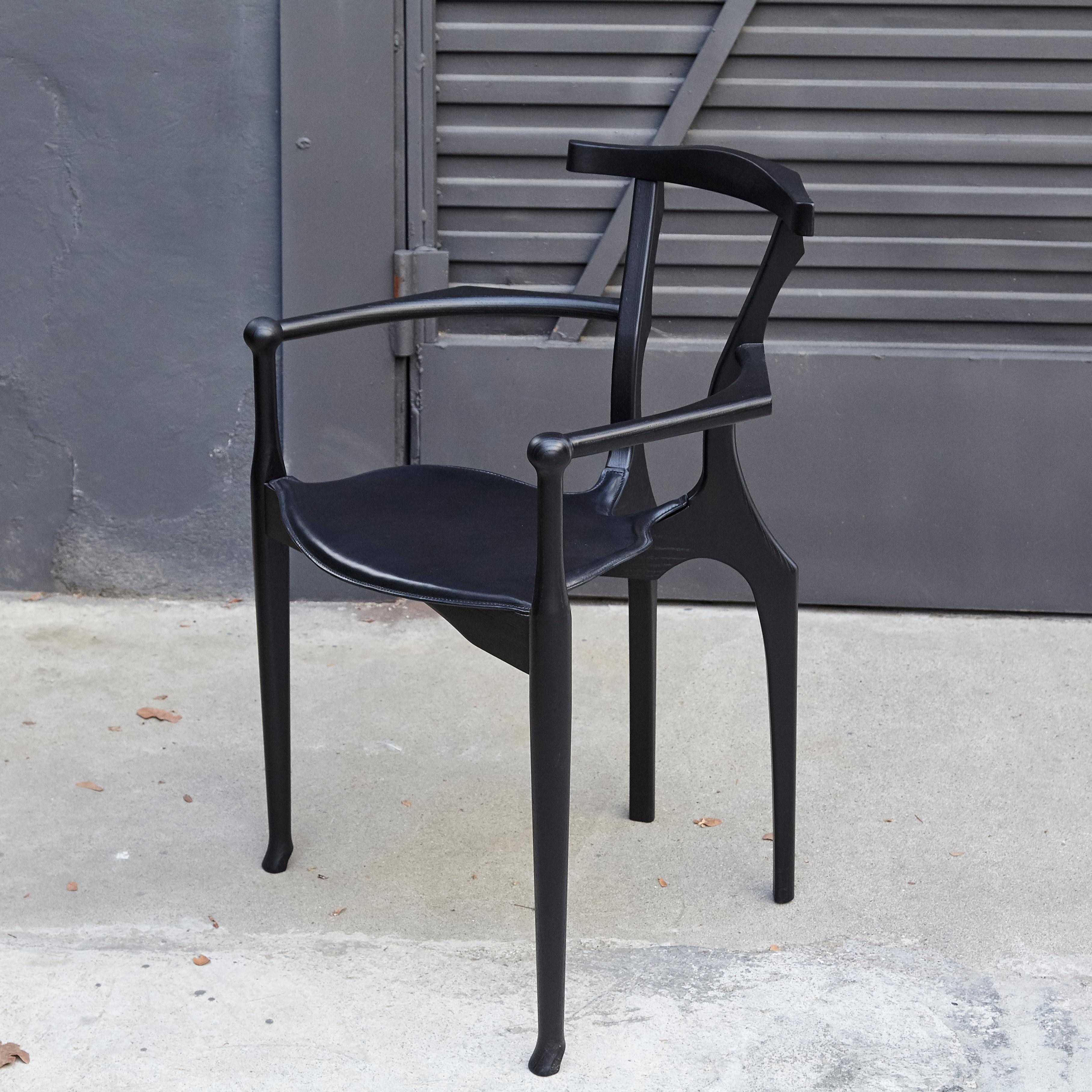 Design by Oscar Tusquets
Manufactured by BD Barcelona.

Solid ash lacquered in black. Seat with internal frame in oak and upholstered in leather.

The Gaulino Chair is one of the best designs by Oscar Tusquets. The chair is made integrally from