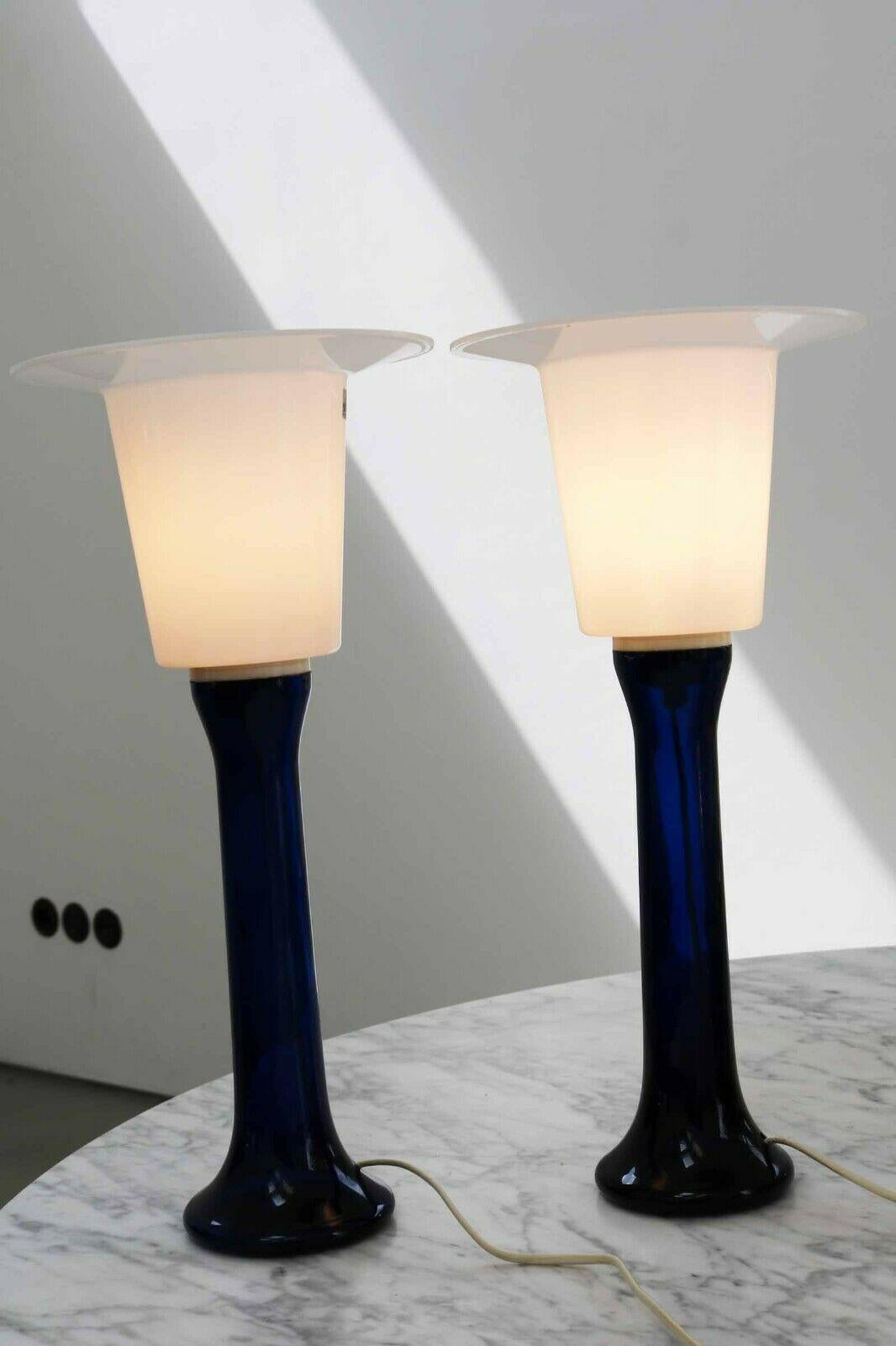 Set of 2 table lamps designed by Uno & Östen Kristiansson and manufactured by Luxus Vittsjö in Sweden. The lamp shade measures: 22.5 cm in diameter. The lamps are in good condition and show only minor signs of use. 





    