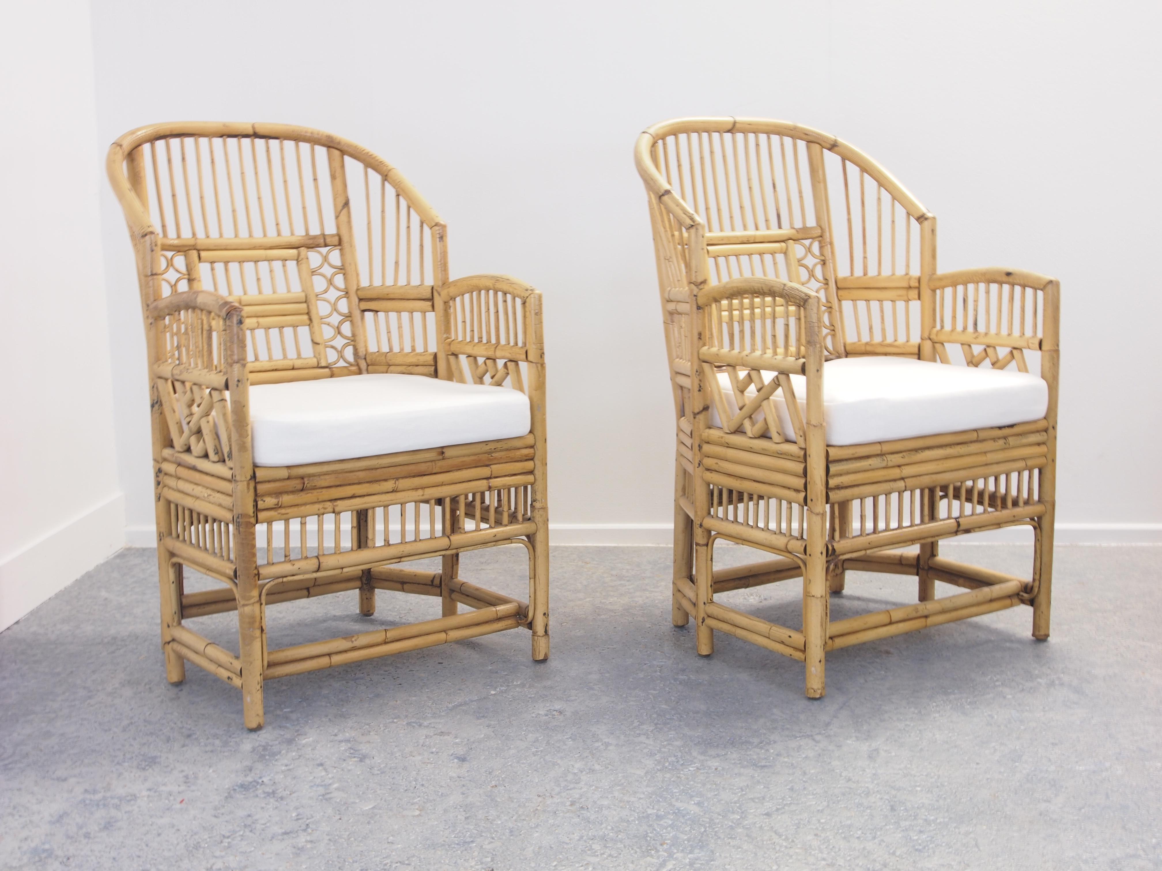 Stunning pair vintage midcentury rattan with wicker Chinese Chippendale/chinoiserie chique/Brighton Pavilion rattan chairs.

Condition: In good vintage condition; normal wear and tear conform its age. New upholstered white cotton