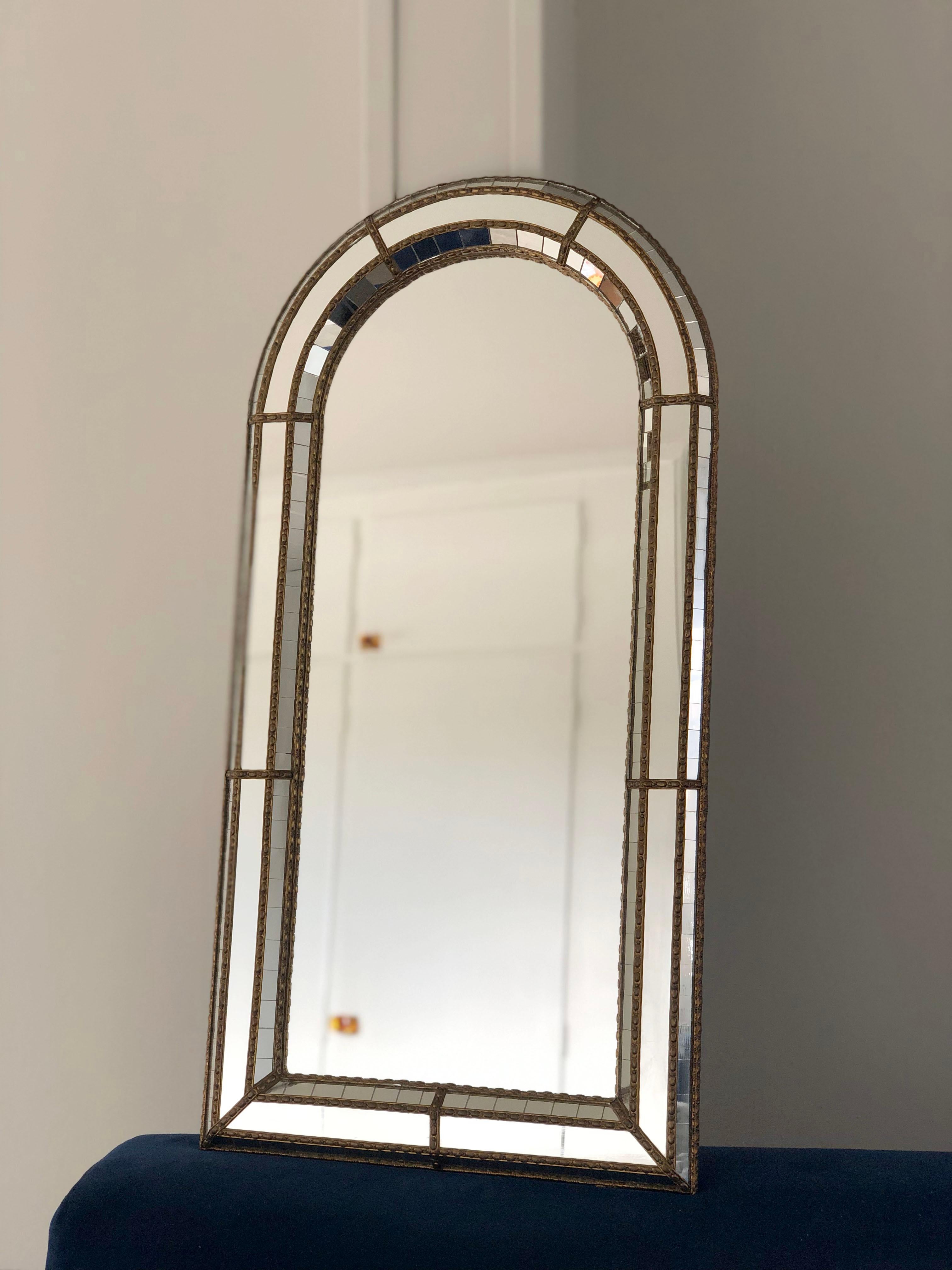 2 identical beautiful Spanish mirrors with a Venetian glass frame with a brass golden strip. The frame is made with small crystals both on the outside and inside, and larger ones in the center line. The brass strip holds the mirrors