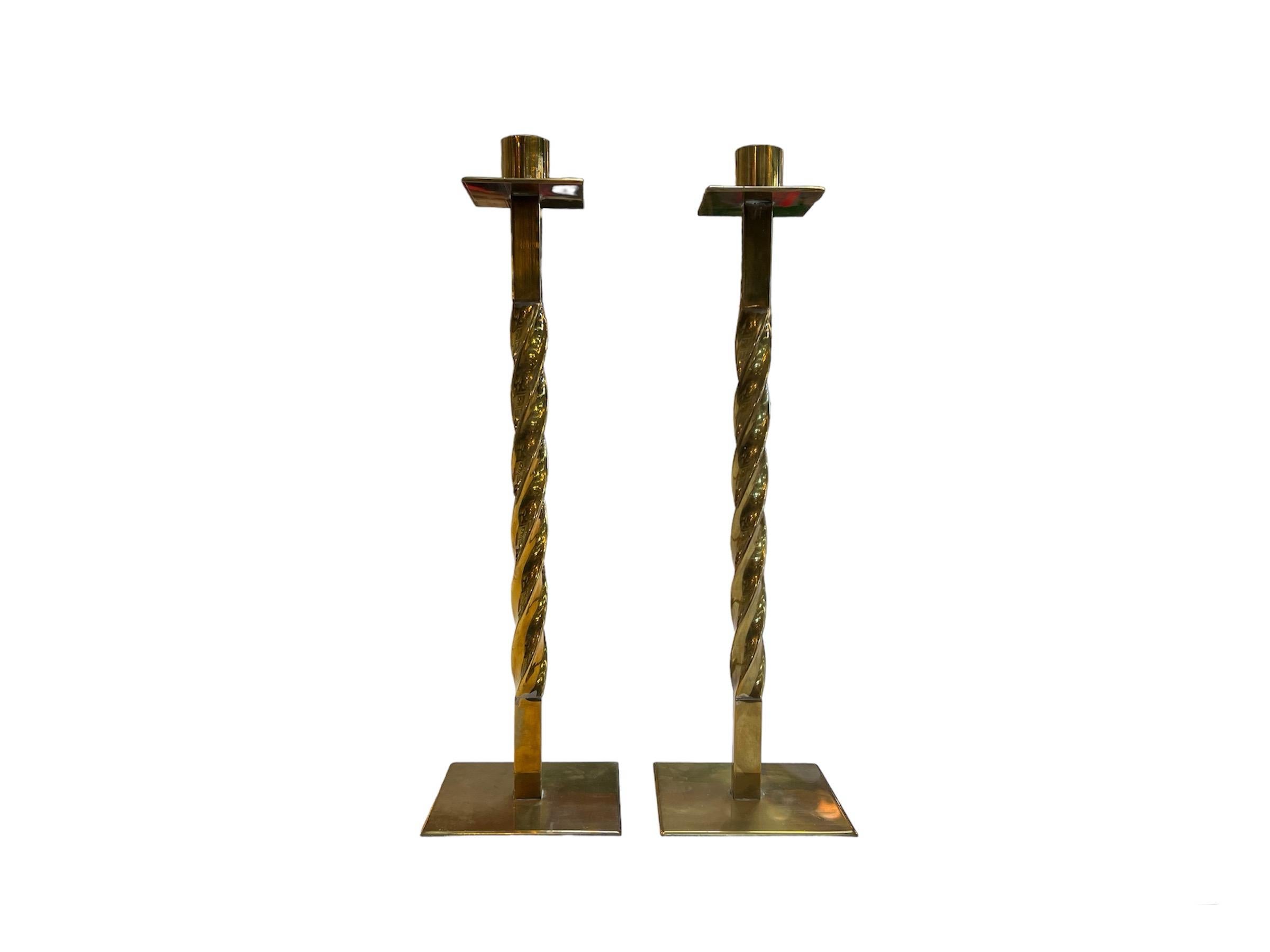Pair of 2 Vintage Italian Decorative Brass Candlesticks: A set of two antique candle holders from Italy made of brass, featuring intricate and ornate decorative designs, adding a touch of vintage elegance to any space.

