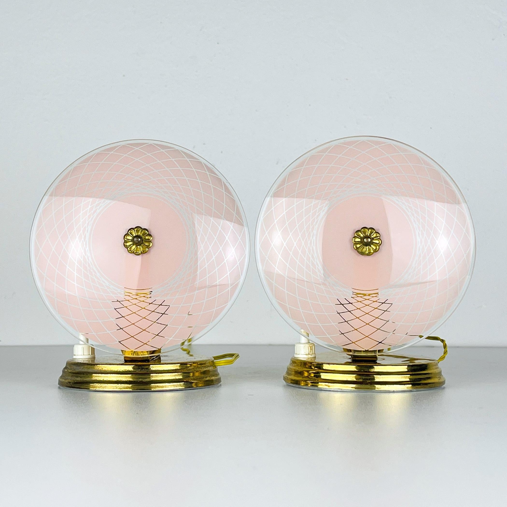 Enhance your space with this delightful pair of table lamps, crafted in Italy during the 1950s. Their enchanting color and graceful light patina imbue them with a timeless charm, making them a versatile addition suitable for bedrooms, nurseries, and