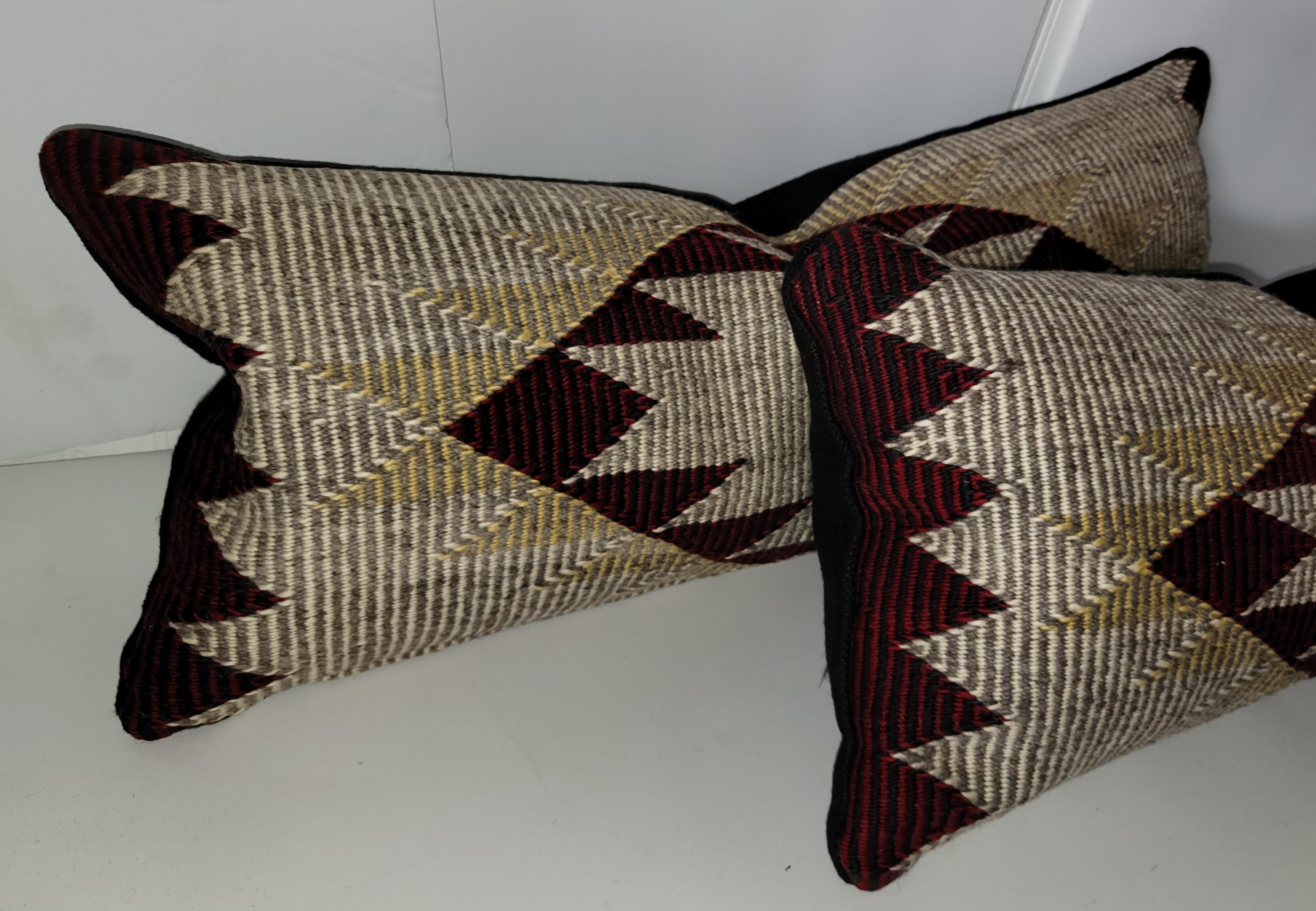 Pair of 20th C Beautiful Navajo Eye Dazzler Bolster Pillows. New Feather and Down insert and zipper casing for cleaning.